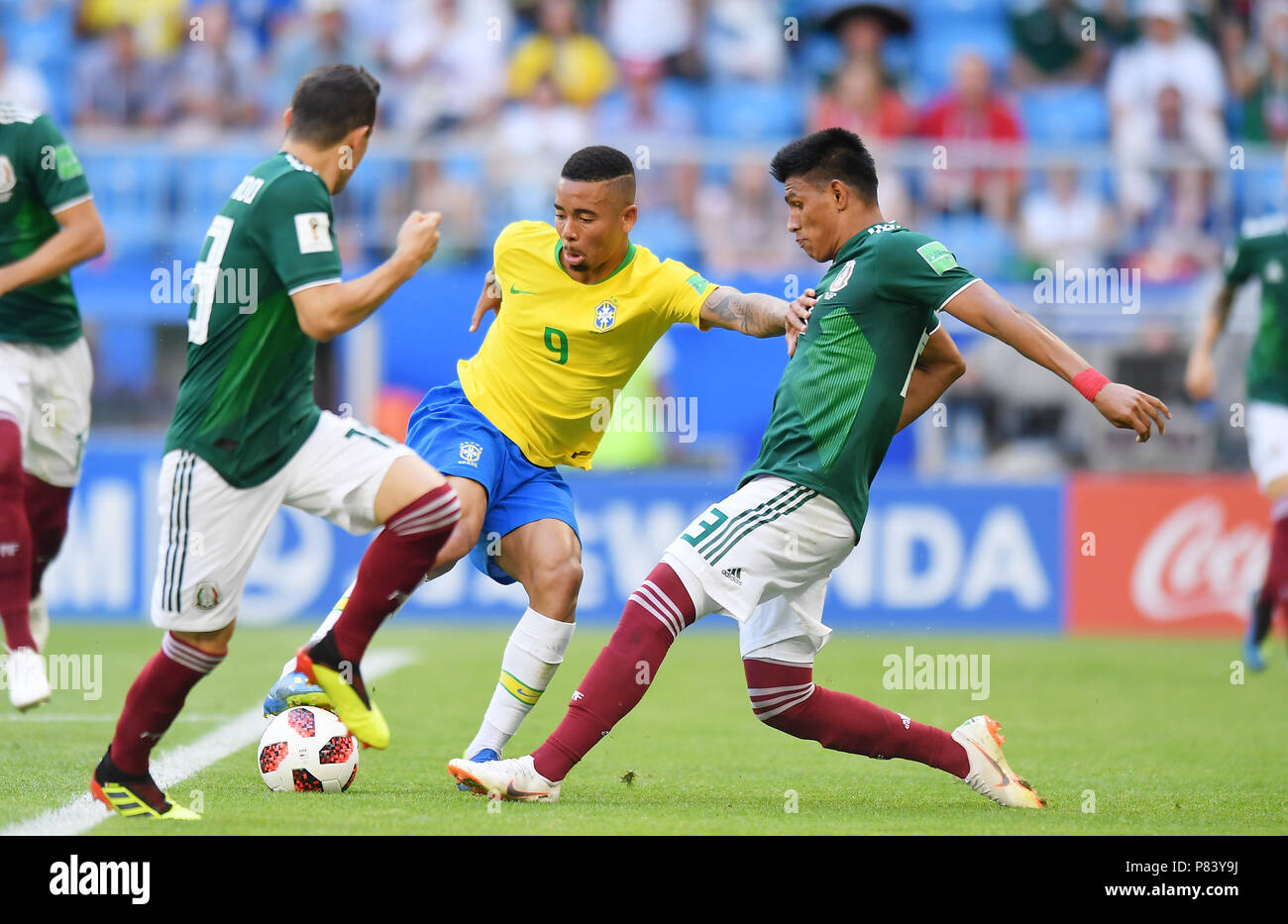 SAMARA, RUSSIA - JULY 02: Andres Guardado and Jesus Gallardo of Mexico competes with Gabriel Jesus of Brazil during the 2018 FIFA World Cup Russia Round of 16 match between Brazil and Mexico at Samara Arena on July 2, 2018 in Samara, Russia. (Photo by Lukasz Laskowski/PressFocus/MB Media) Stock Photo