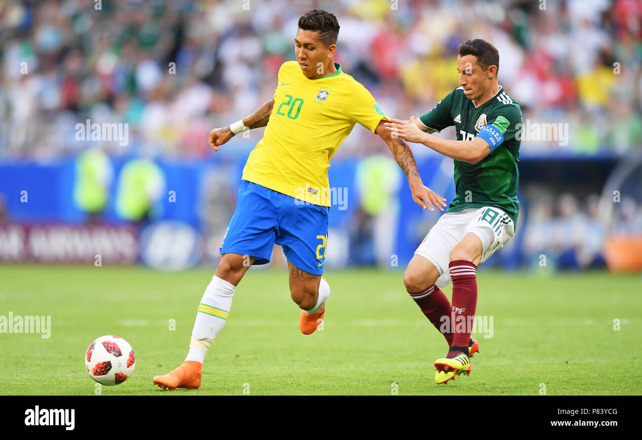 SAMARA, RUSSIA - JULY 02: Roberto Firmino of Brazil competes with Andres Guardado of Mexico during the 2018 FIFA World Cup Russia Round of 16 match between Brazil and Mexico at Samara Arena on July 2, 2018 in Samara, Russia. (Photo by Lukasz Laskowski/PressFocus/MB Media) Stock Photo