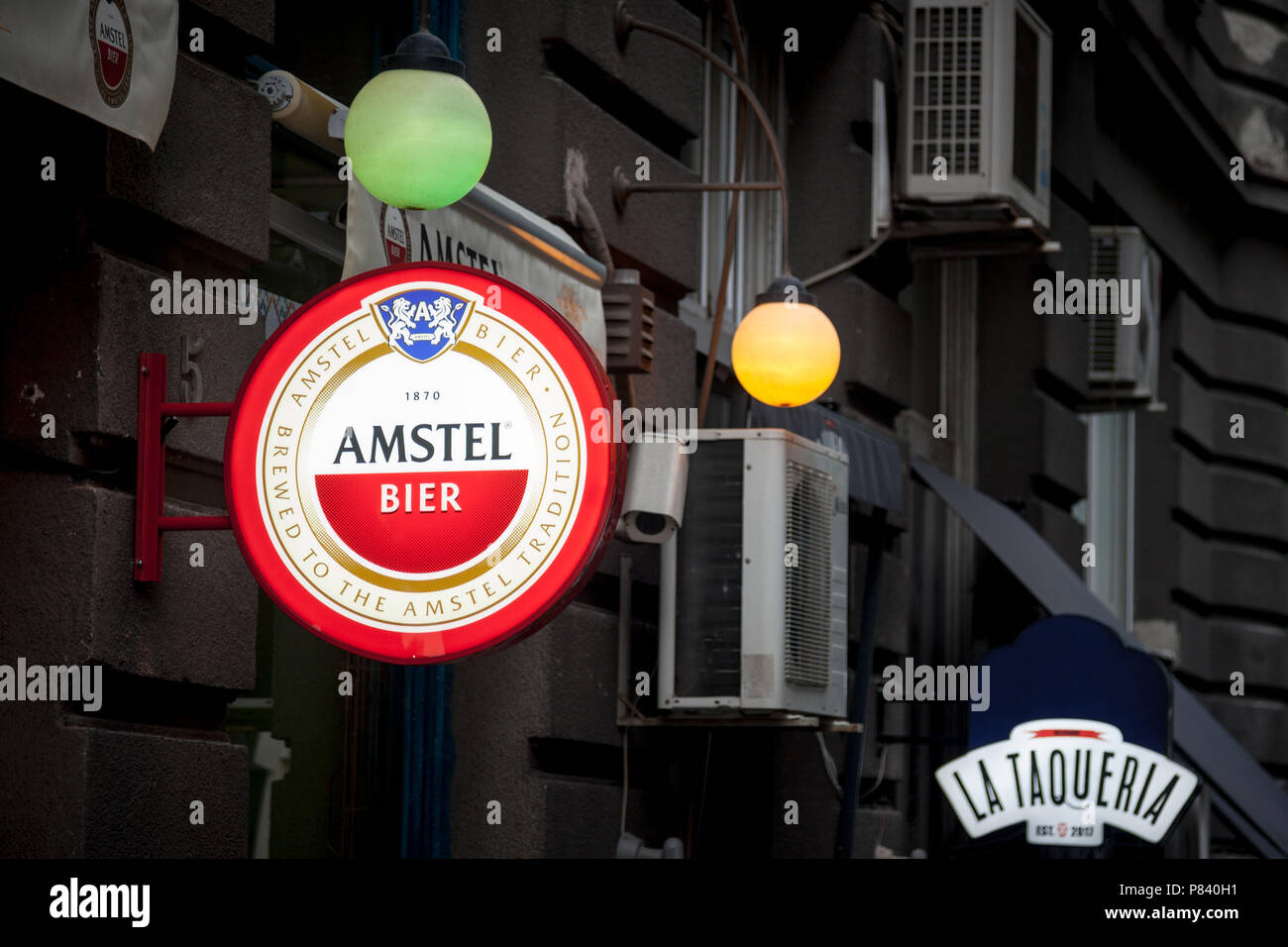 BELGRADE, SERBIA - JULY 7, 2018: Logo of Amstel beer on a bar sign with its distinctive visual. Amstel is a Dutch light pilsner beer produced in Amste Stock Photo