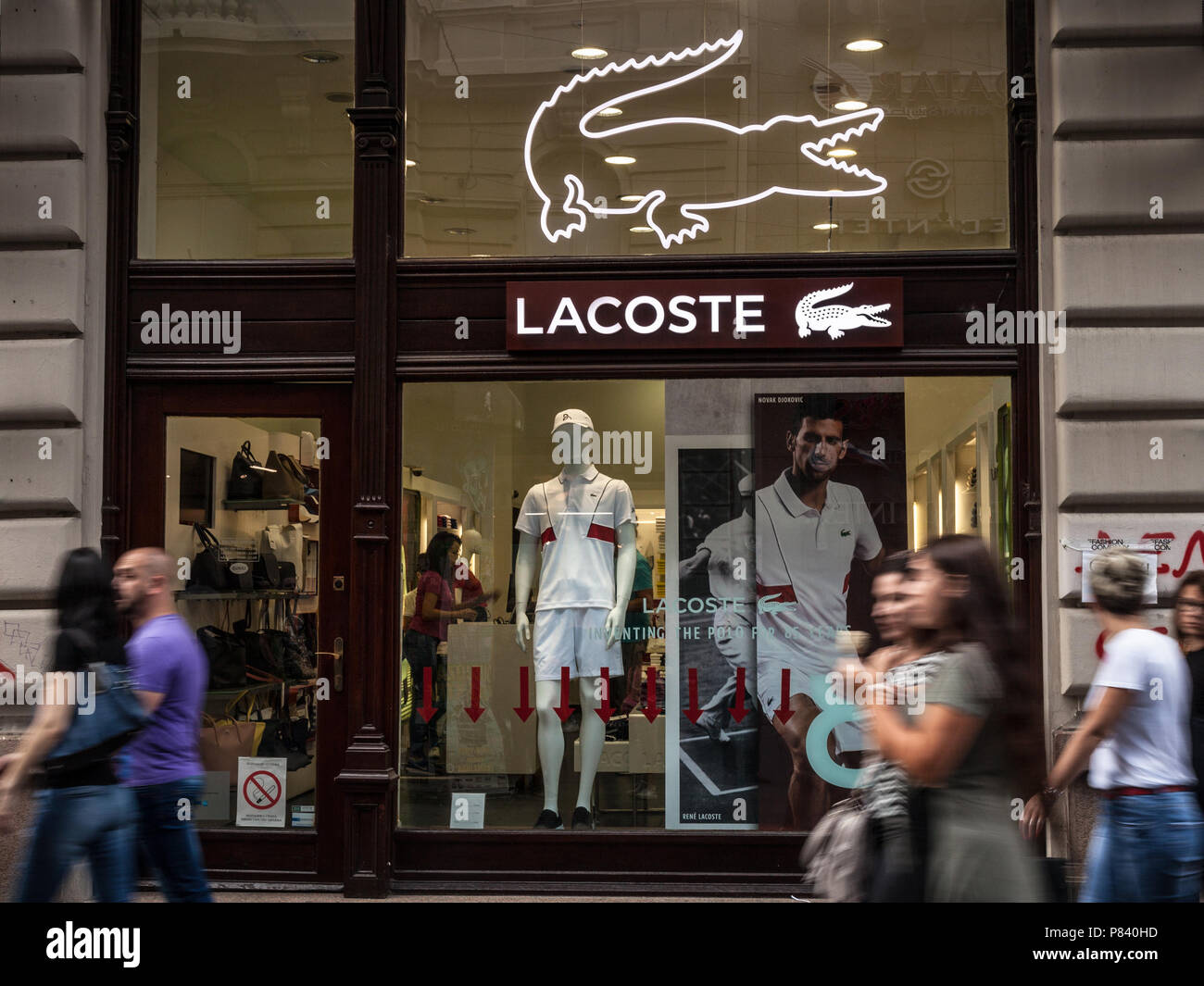 BELGRADE, SERBIA - JULY 8, 2018: Logo of Lacoste on their main store for Belgrade. Lacoste is a French clothing company, selling clothing, footwear, e Stock Photo