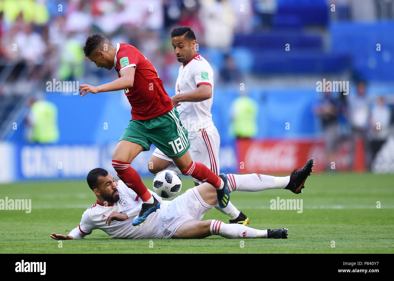 SAINT PETERSBURG, RUSSIA - JUNE 15: Roozbeh Cheshmi of IR Iran competes with Amine Harit of Morocco during the 2018 FIFA World Cup Russia group B match between Morocco and Iran at Saint Petersburg Stadium on June 15, 2018 in Saint Petersburg, Russia. (Photo by Lukasz Laskowski/PressFocus/MB Media) Stock Photo