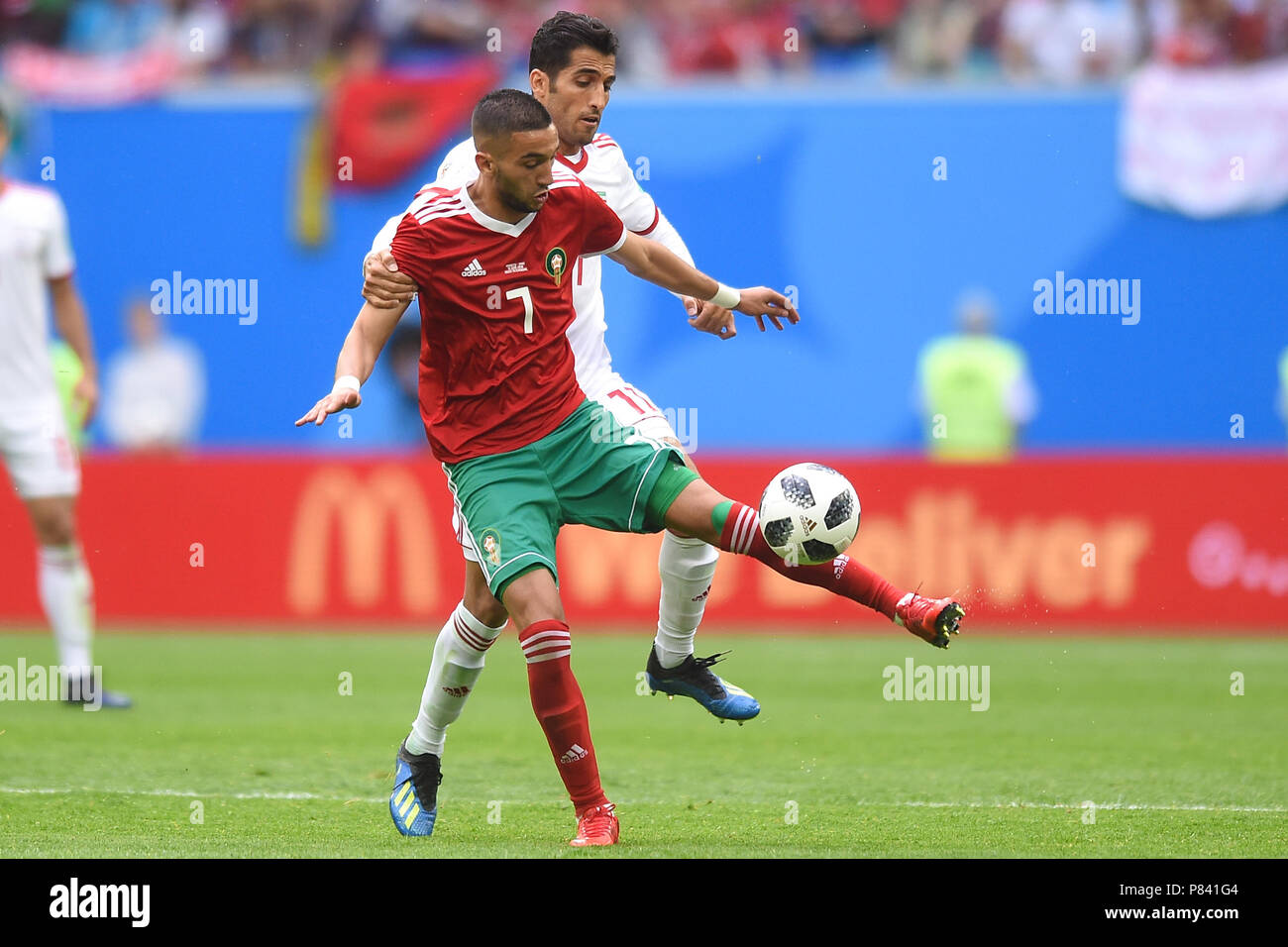 SAINT PETERSBURG, RUSSIA - JUNE 15: Vahid Amiri of Iran tackles Hakim Ziyach of Morocco during the 2018 FIFA World Cup Russia group B match between Morocco and Iran at Saint Petersburg Stadium on June 15, 2018 in Saint Petersburg, Russia. (Photo by Lukasz Laskowski/PressFocus/MB Media) Stock Photo