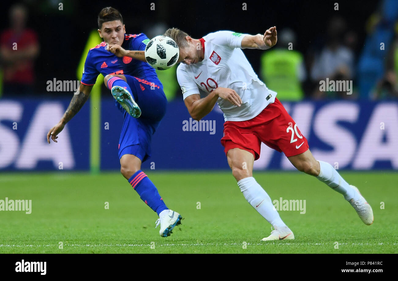 KAZAN, RUSSIA - JUNE 24: Juan Quintero of Colombia competes with Lukasz Piszczek of Poland during the 2018 FIFA World Cup Russia group H match between Poland and Colombia at Kazan Arena on June 24, 2018 in Kazan, Russia. (Photo by Lukasz Laskowski/PressFocus/MB Media) Stock Photo