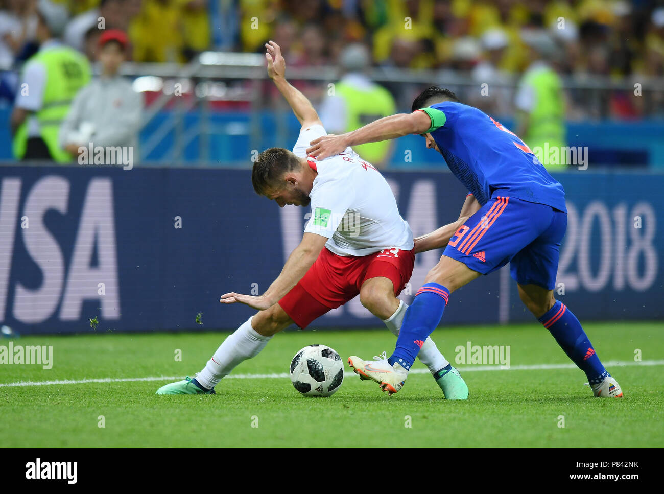 KAZAN, RUSSIA - JUNE 24: James Rodriguez of Colombia competes with Maciej Rybus of Poland during the 2018 FIFA World Cup Russia group H match between Poland and Colombia at Kazan Arena on June 24, 2018 in Kazan, Russia. (Photo by Lukasz Laskowski/PressFocus/MB Media) Stock Photo