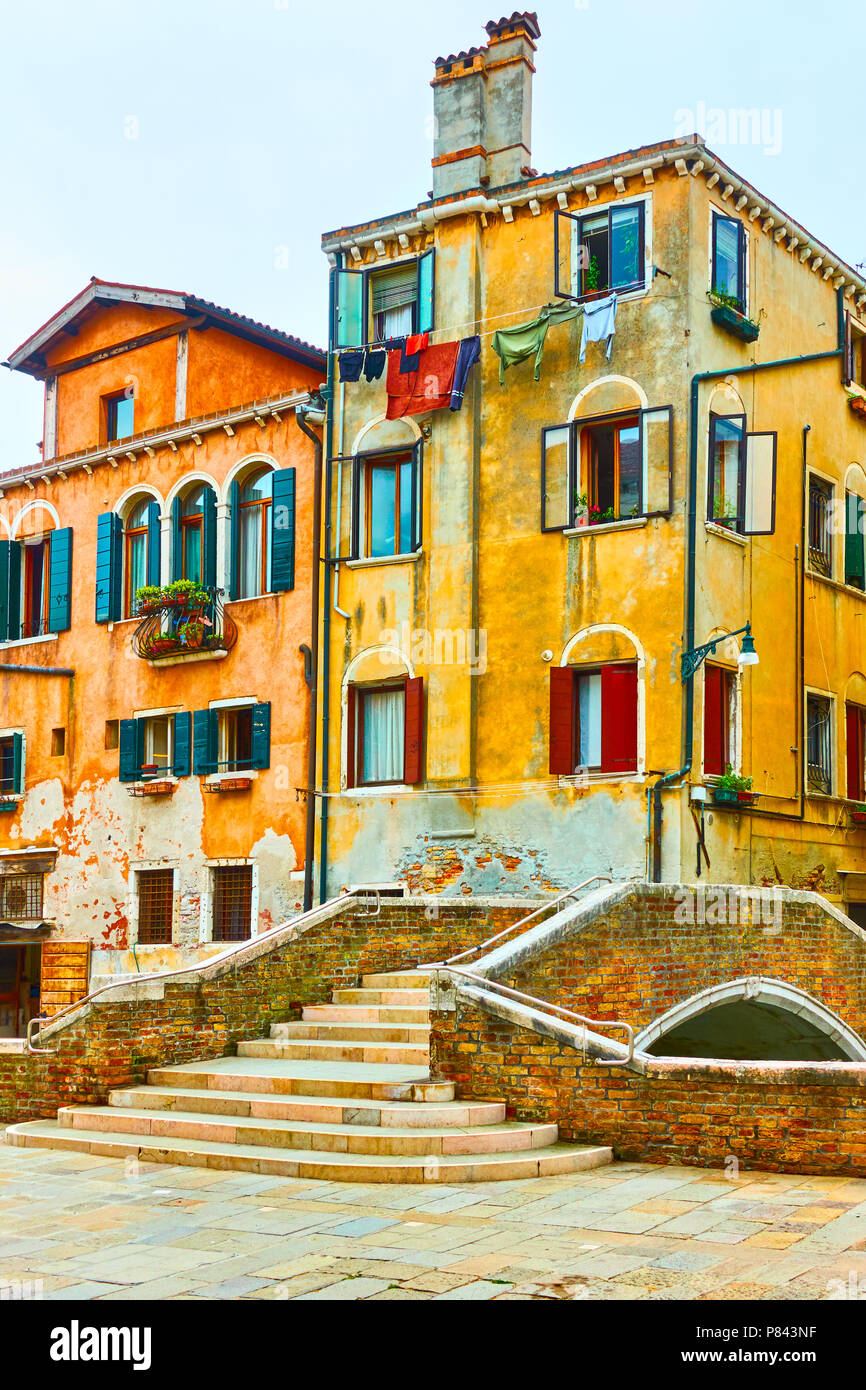 Old buildings and small bridge over canal in Venice, Italy Stock Photo