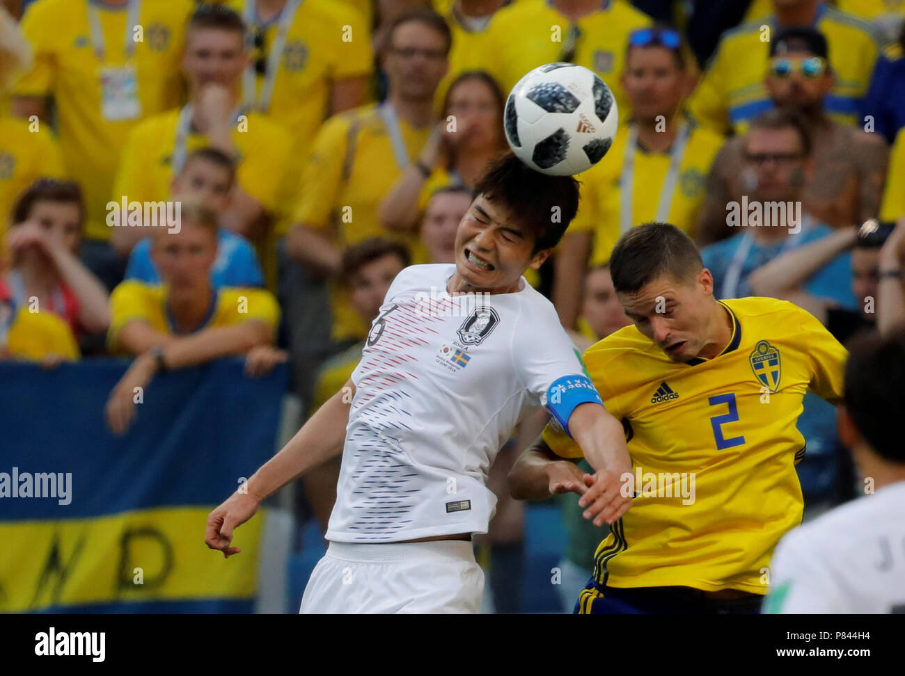 NIZHNY NOVGOROD, RUSSIA - JUNE 18: Mikael Lustig (R) of Sweden national team and Sungyueng Ki of Korea Republic national team vie for the ball during the 2018 FIFA World Cup Russia group F match between Sweden and Korea Republic at Nizhny Novgorod Stadium on June 18, 2018 in Nizhny Novgorod, Russia. Stock Photo