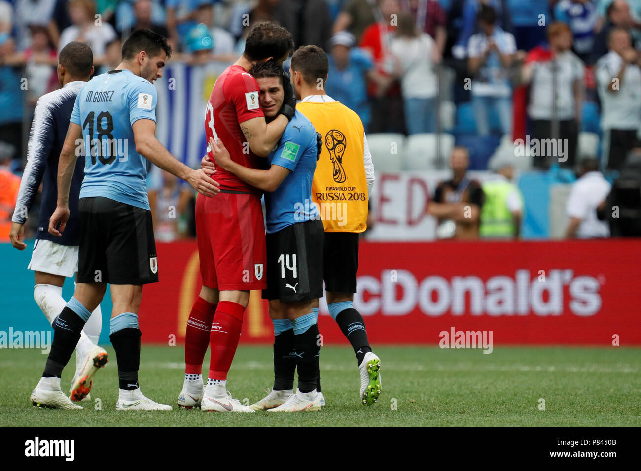 NIZHNY NOVGOROD, RUSSIA - JULY 6: Maximiliano Gomez (N18), Martin Silva and Lucas Torreira (N14) of Uruguay national team after the 2018 FIFA World Cup Russia Quarter Final match between Uruguay and France at Nizhny Novgorod Stadium on July 6, 2018 in Nizhny Novgorod, Russia. (MB Media) Stock Photo