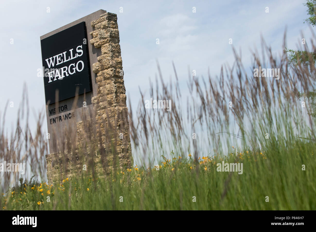 A logo sign outside of a facility occupied by Wells Fargo in West Des Moines, Iowa, on June 30, 2018. Stock Photo