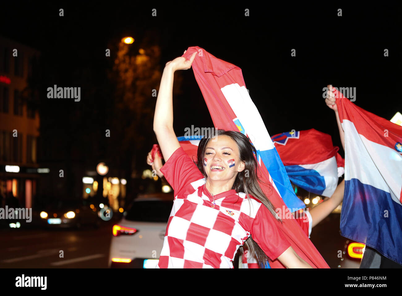 Munich, Germany. 07th July, 2018. Croatian girl cheering up after the won match. Fans of Russia and Crotia watched the quarter finals of the FIFA world cup between Russia and Crotia in Munich. Crotia won the match with a 6-5 in the penealties. Credit: Alexander Pohl/Pacific Press/Alamy Live News Stock Photo