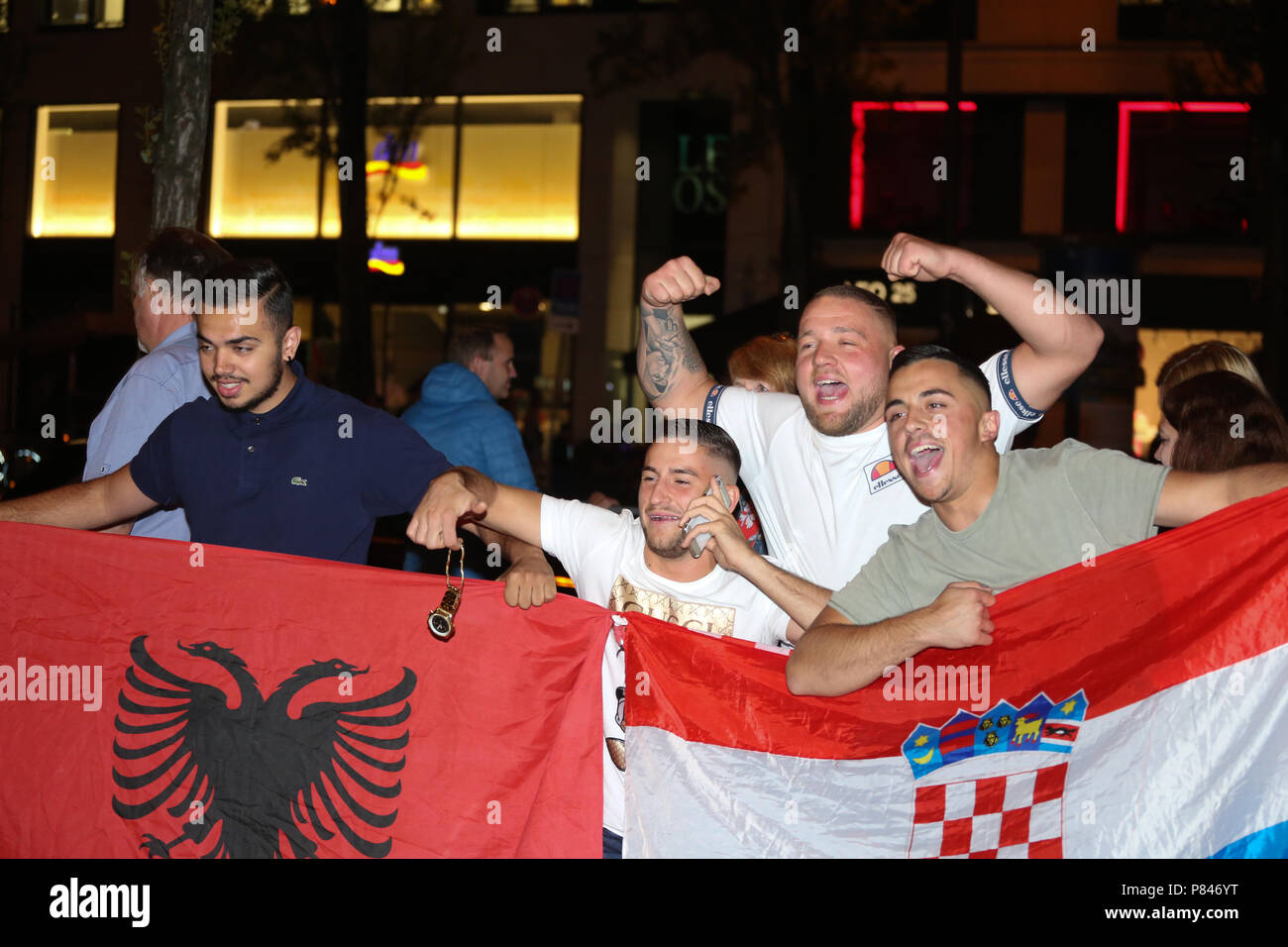 Munich, Germany. 07th July, 2018. Croatian fans hold an Albanian and a Croatian flag. Fans of Russia and Crotia watched the quarter finals of the FIFA world cup between Russia and Crotia in Munich. Crotia won the match with a 6-5 in the penealties. Credit: Alexander Pohl/Pacific Press/Alamy Live News Stock Photo