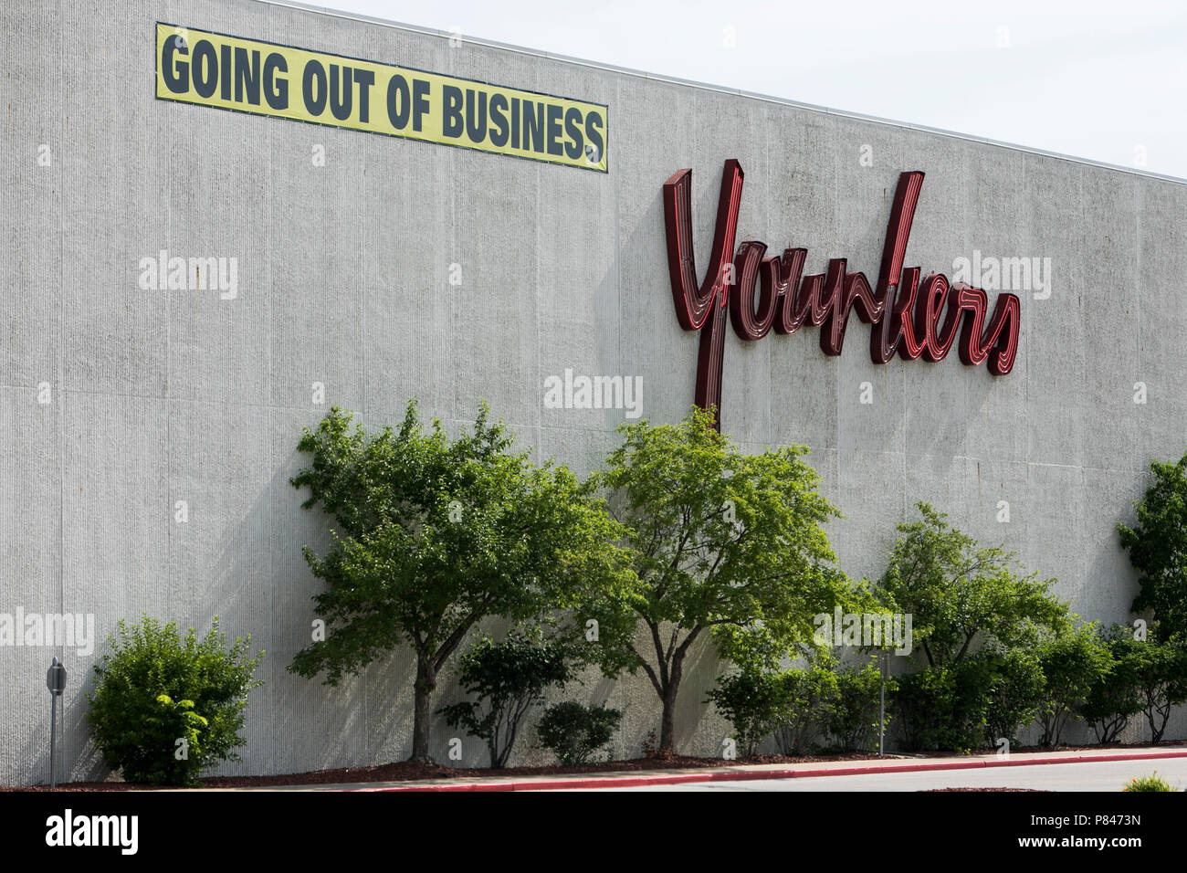 A logo sign and 'Going Out Of Business' banner outside of Younkers retail department store in West Des Moines, Iowa, on June 30, 2018. Stock Photo