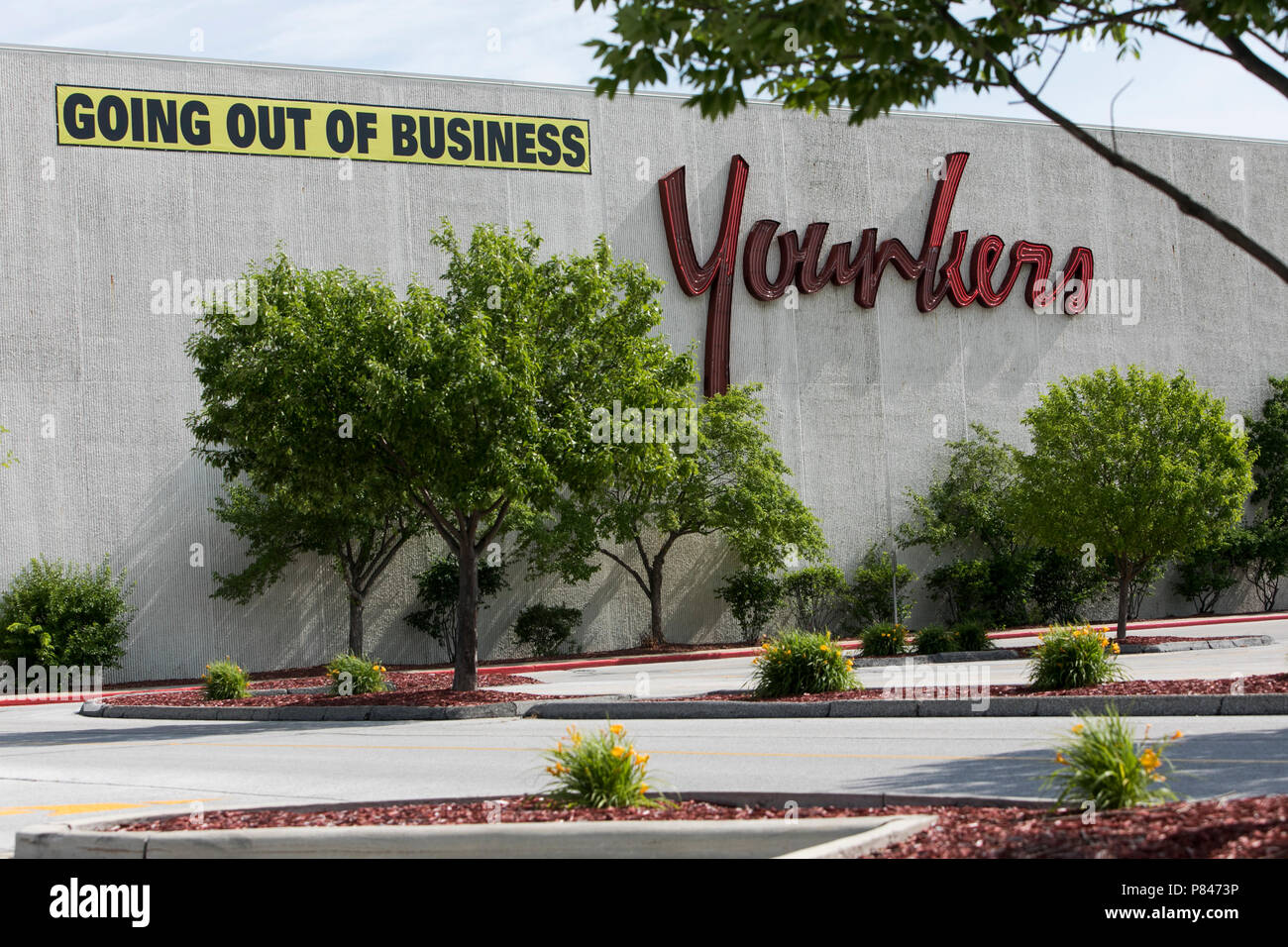 A logo sign and 'Going Out Of Business' banner outside of Younkers retail department store in West Des Moines, Iowa, on June 30, 2018. Stock Photo