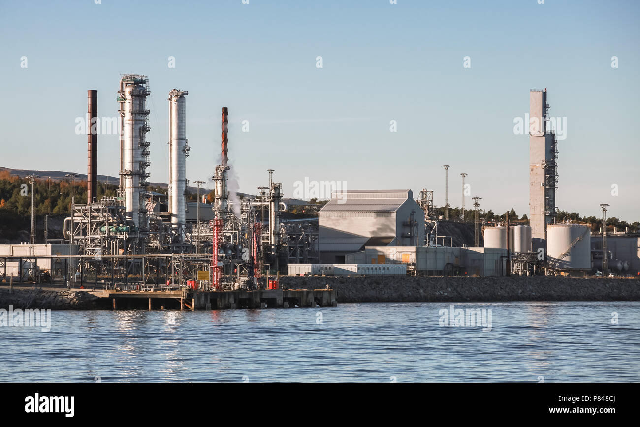 Norwegian oil plant, coastal industrial landscape in morning sunlight Stock Photo