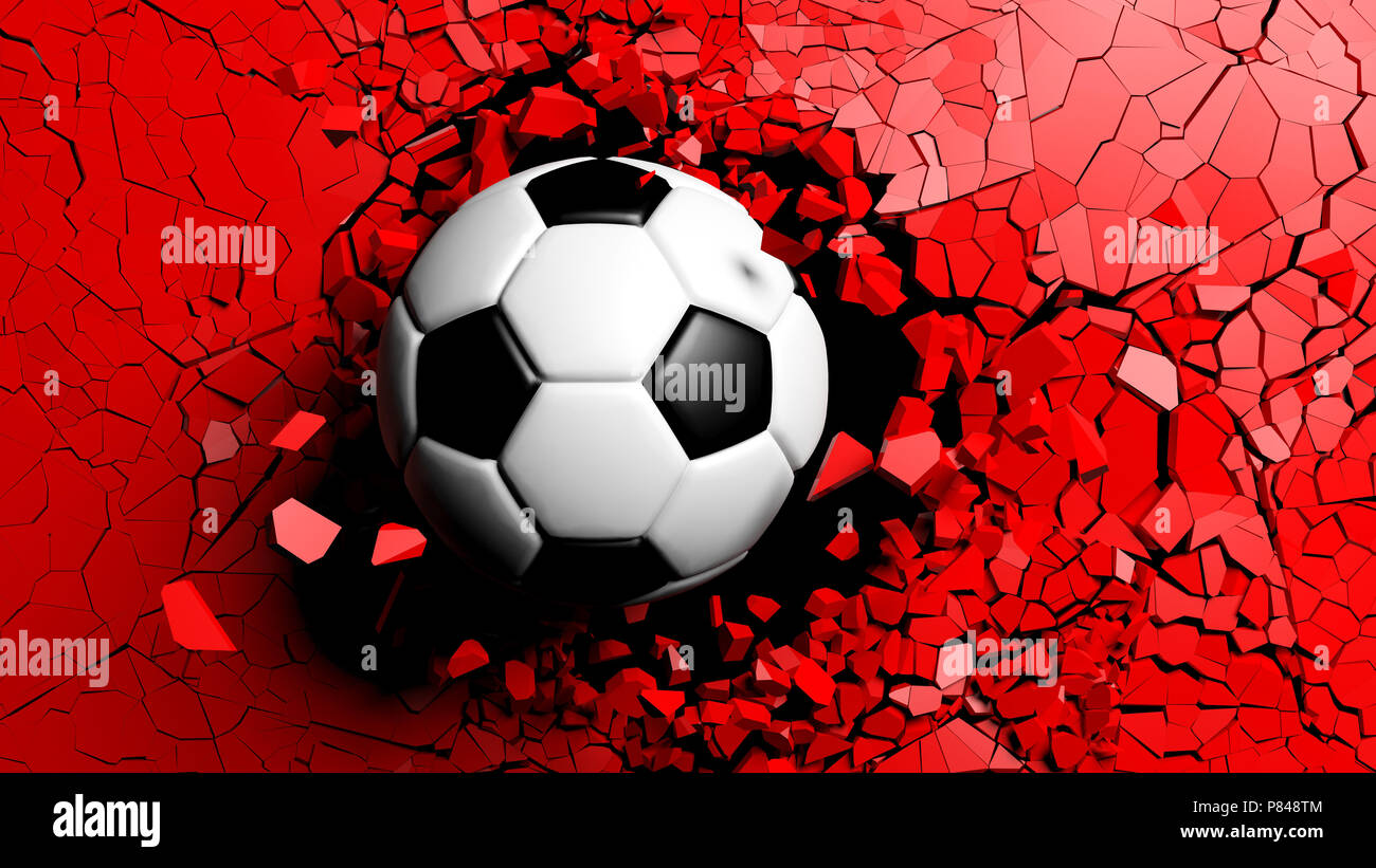 Football concept. Soccer ball breaking with great force through a red
