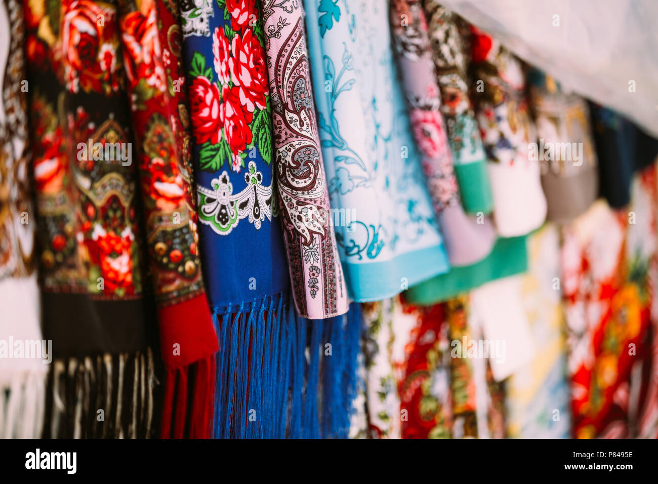 Rows Of Traditional Russian Colorfull Scarfs And Headscarfs In Market. Popular Souvenir From Russia. Stock Photo