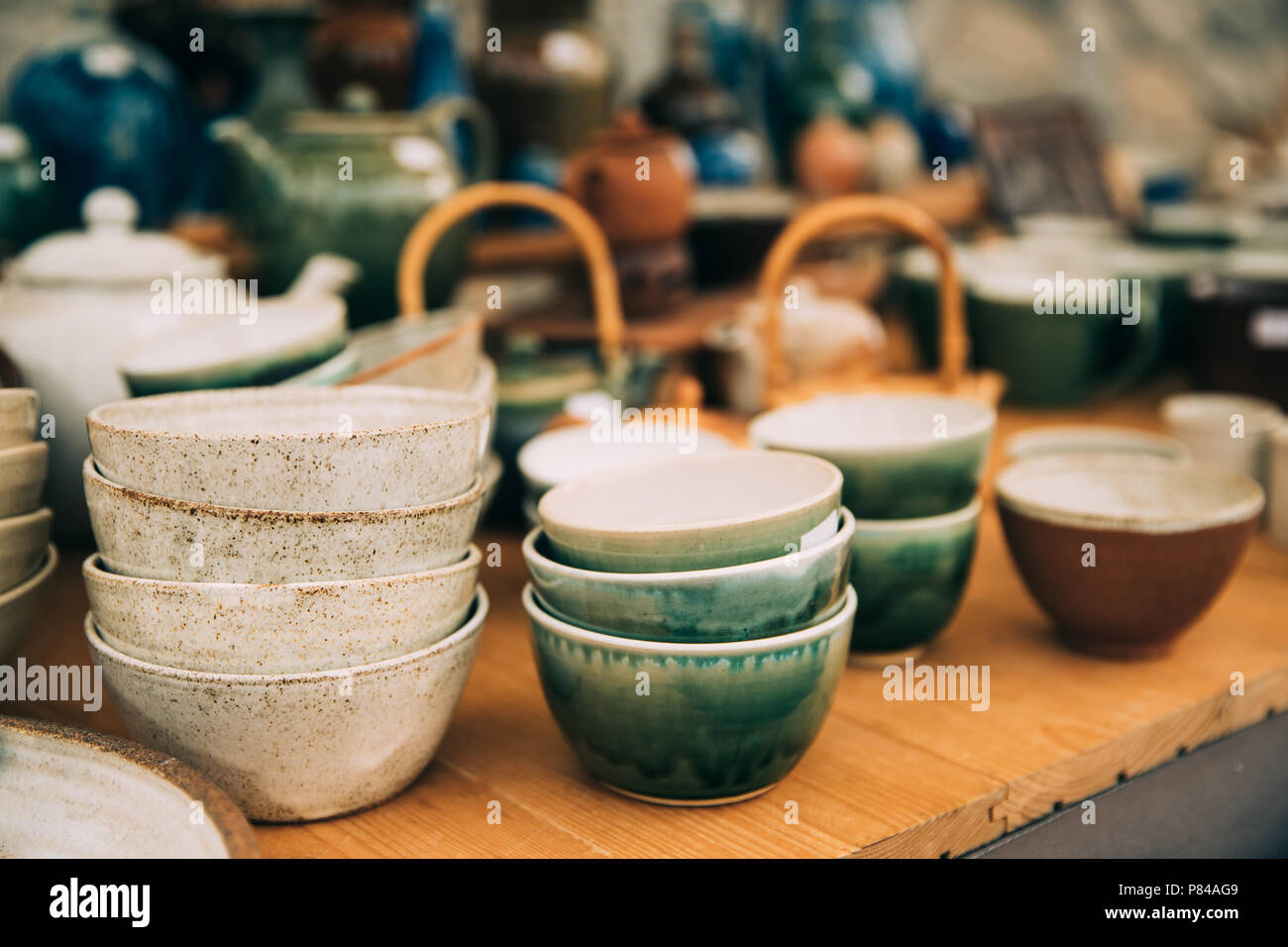 Ceramic Clay Crafts. Ceramic Dishware In Market. Bowls Of Different Sizes, Colors And Shapes. Stock Photo