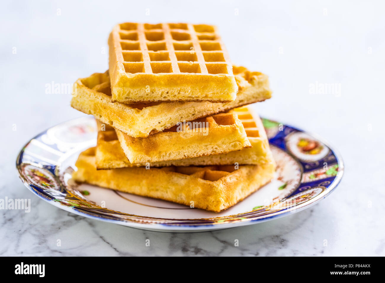 Close-up several waffles on rustic plate. Stock Photo