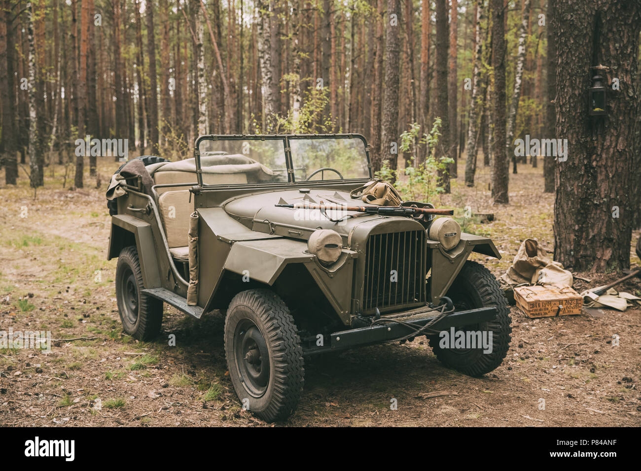 Russian Soviet World War II Four-wheel Drive Army Truck Gaz-67 Car In Forest. WWII Equipment Of Red Army. Stock Photo