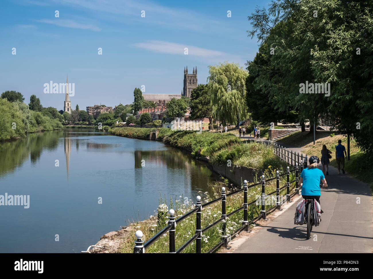 Riverside walkway along River Severn through city of Worcester, with Worcester Cathedral in the background, Worcestershire, West Midlands, UK Stock Photo