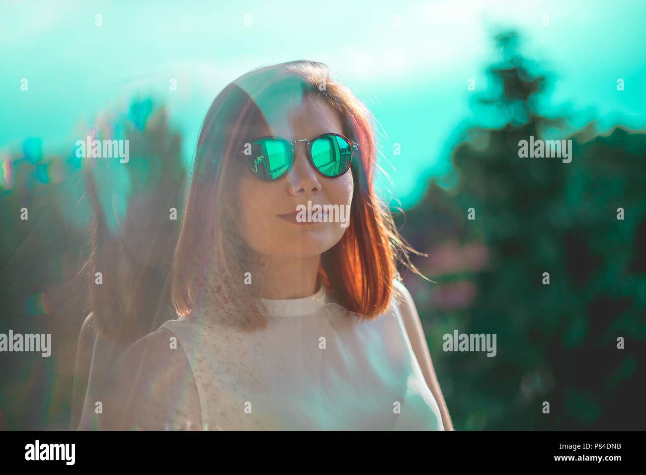Portrait Of Beautiful Redhair Woman Wearing Glasses Teal And