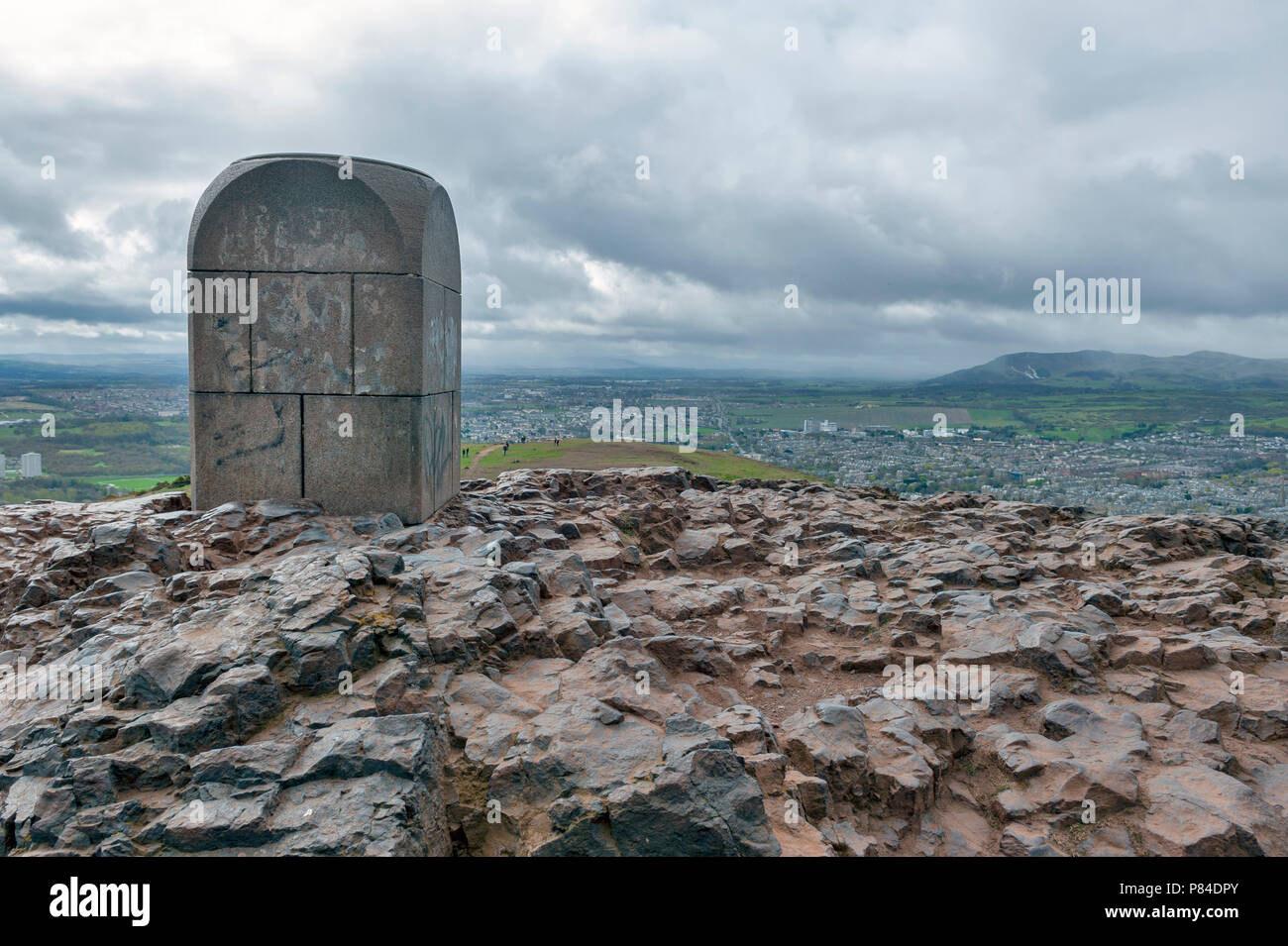The stone landmark monument at the summit of Arthur’s Seat, the highest point in Edinburgh located at Holyrood Park in Edinburgh, Scotland, UK Stock Photo