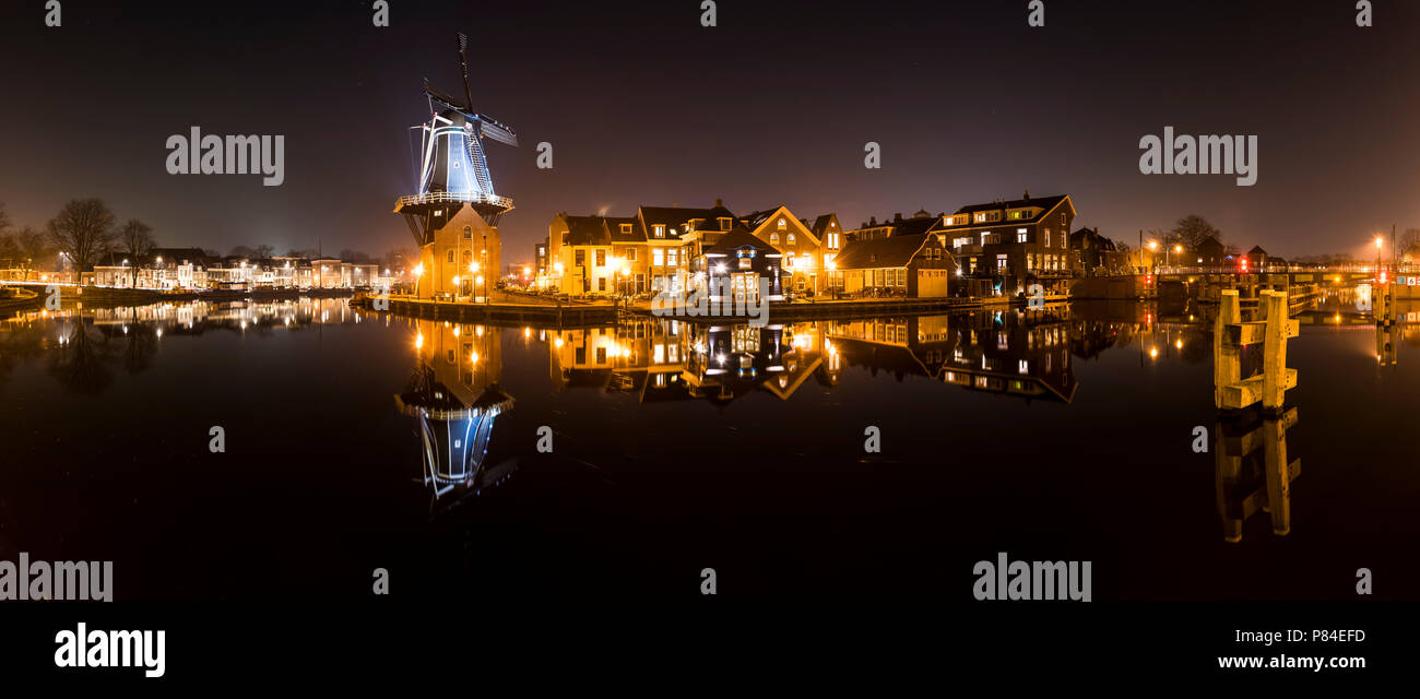 Haarlem, The Netherlands - February 20, 2018: Panorama of the Mill de Adriaan at night at the river Spaarne in Haarlem. Stock Photo