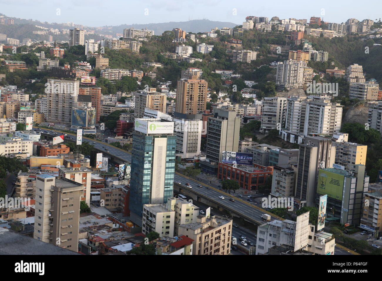 Colinas de Bello Monte and Valle Arriba from the Sabana Grande Business District in Caracas Venezuela. Marcos Kirschstein and Vicente Quintero. 2018 Stock Photo