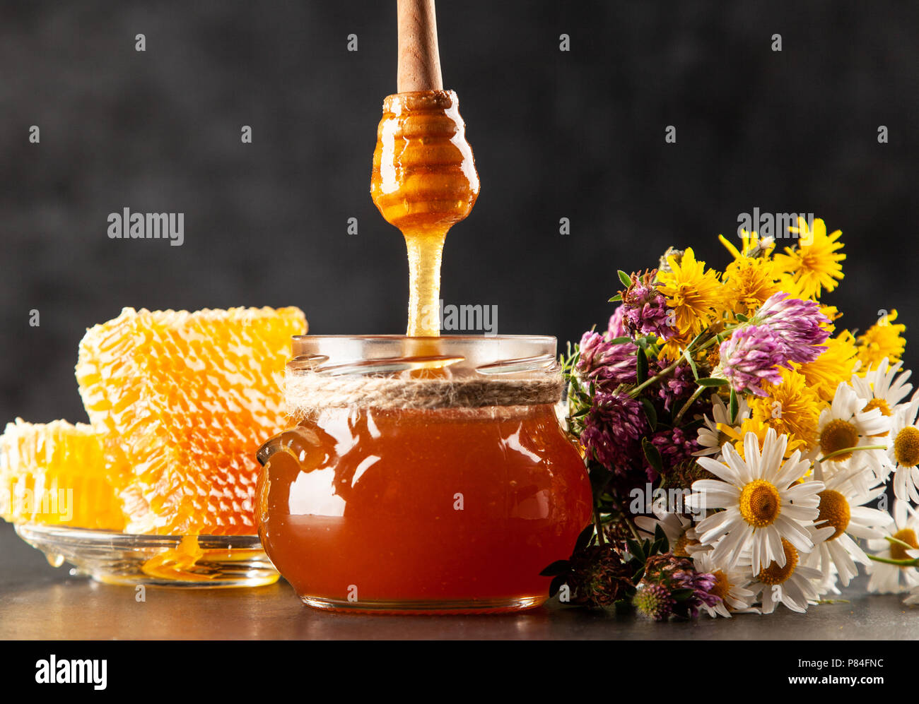 Honey jar and dipper Stock Photo Alamy