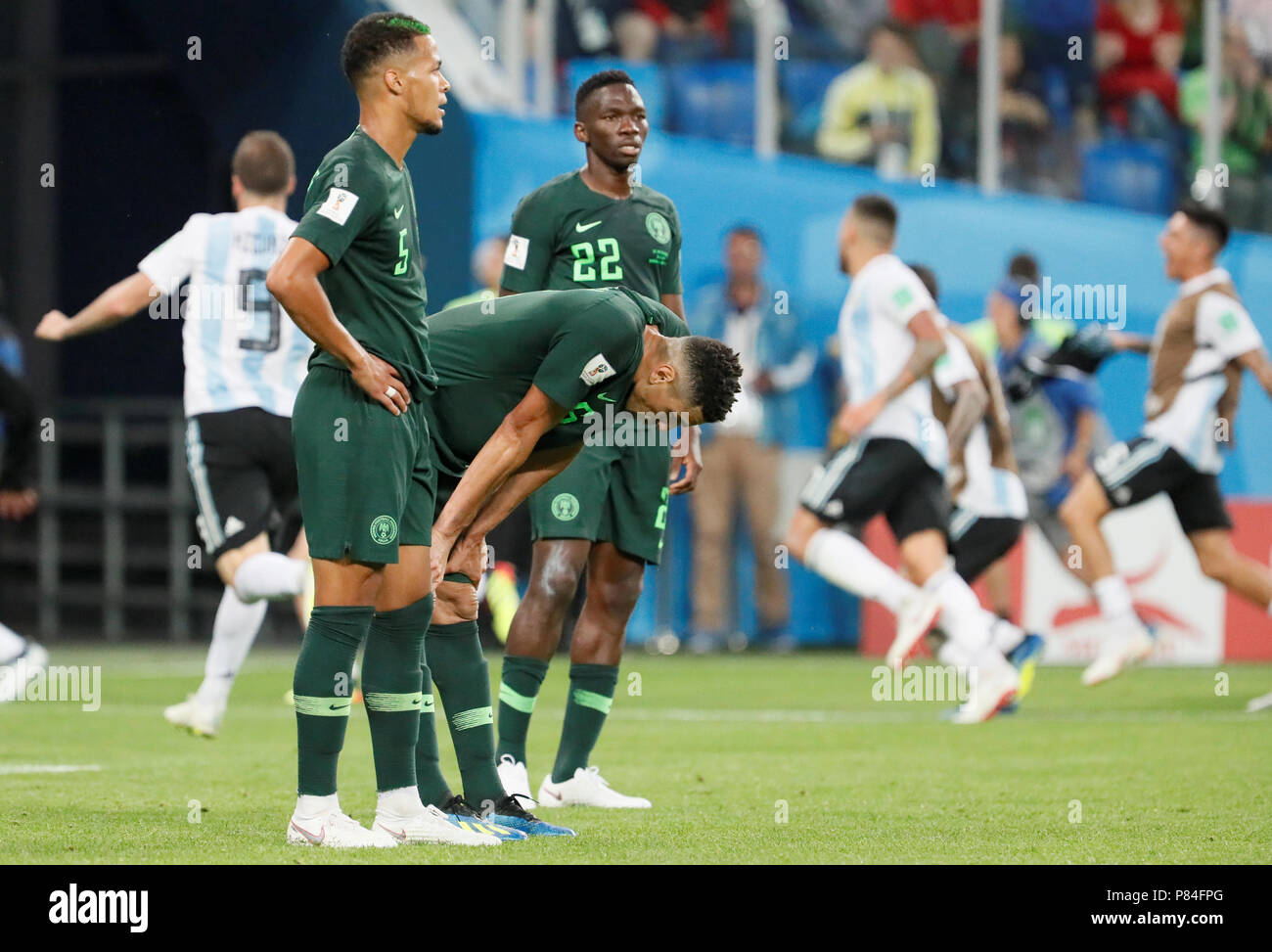 SAINT PETERSBURG, RUSSIA - JUNE 26: (L to R) William Ekong, Leon Balogun and Kenneth Omeruo of Nigeria national team react as Argentina national team players celebrate a goal in background during the 2018 FIFA World Cup Russia group D match between Nigeria and Argentina at Saint Petersburg Stadium on June 26, 2018 in Saint Petersburg, Russia. (MB Media) Stock Photo