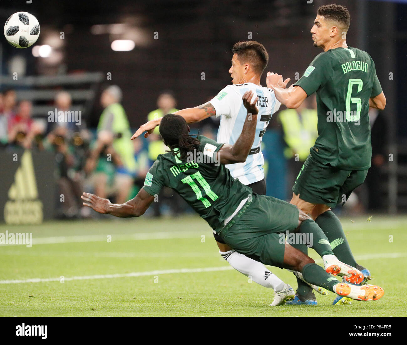 SAINT PETERSBURG, RUSSIA - JUNE 26: Maximiliano Meza (C) of Argentina national team vies for the ball with Victor Moses and Leon Balogun (R) of Nigeria national team during the 2018 FIFA World Cup Russia group D match between Nigeria and Argentina at Saint Petersburg Stadium on June 26, 2018 in Saint Petersburg, Russia. (MB Media) Stock Photo
