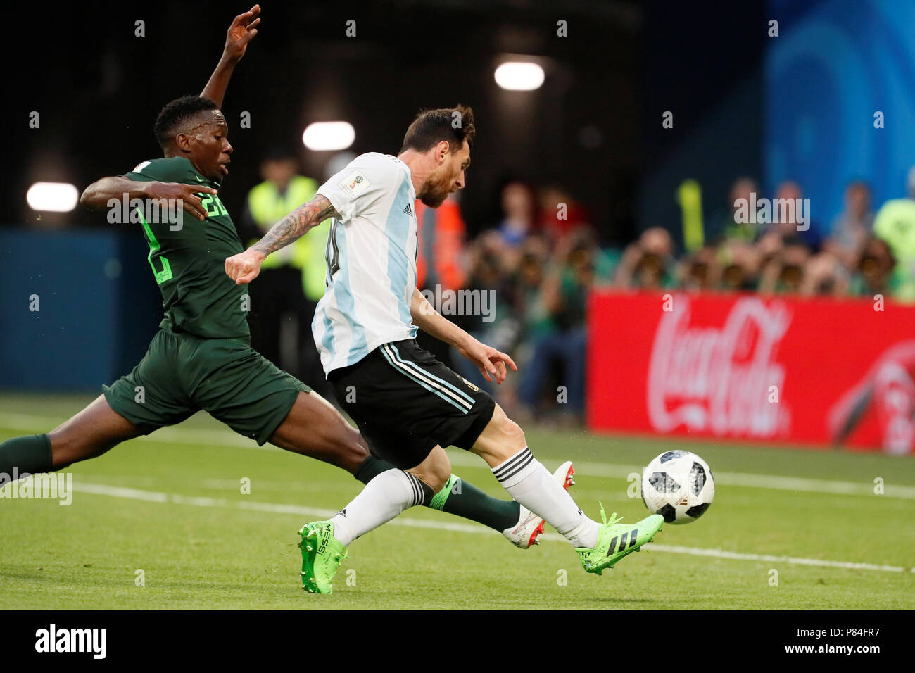 SAINT PETERSBURG, RUSSIA - JUNE 26: Lionel Messi (R) of Argentina national team shoots to score a goal as Kenneth Omeruo of Nigeria national team defends during the 2018 FIFA World Cup Russia group D match between Nigeria and Argentina at Saint Petersburg Stadium on June 26, 2018 in Saint Petersburg, Russia. (MB Media) Stock Photo