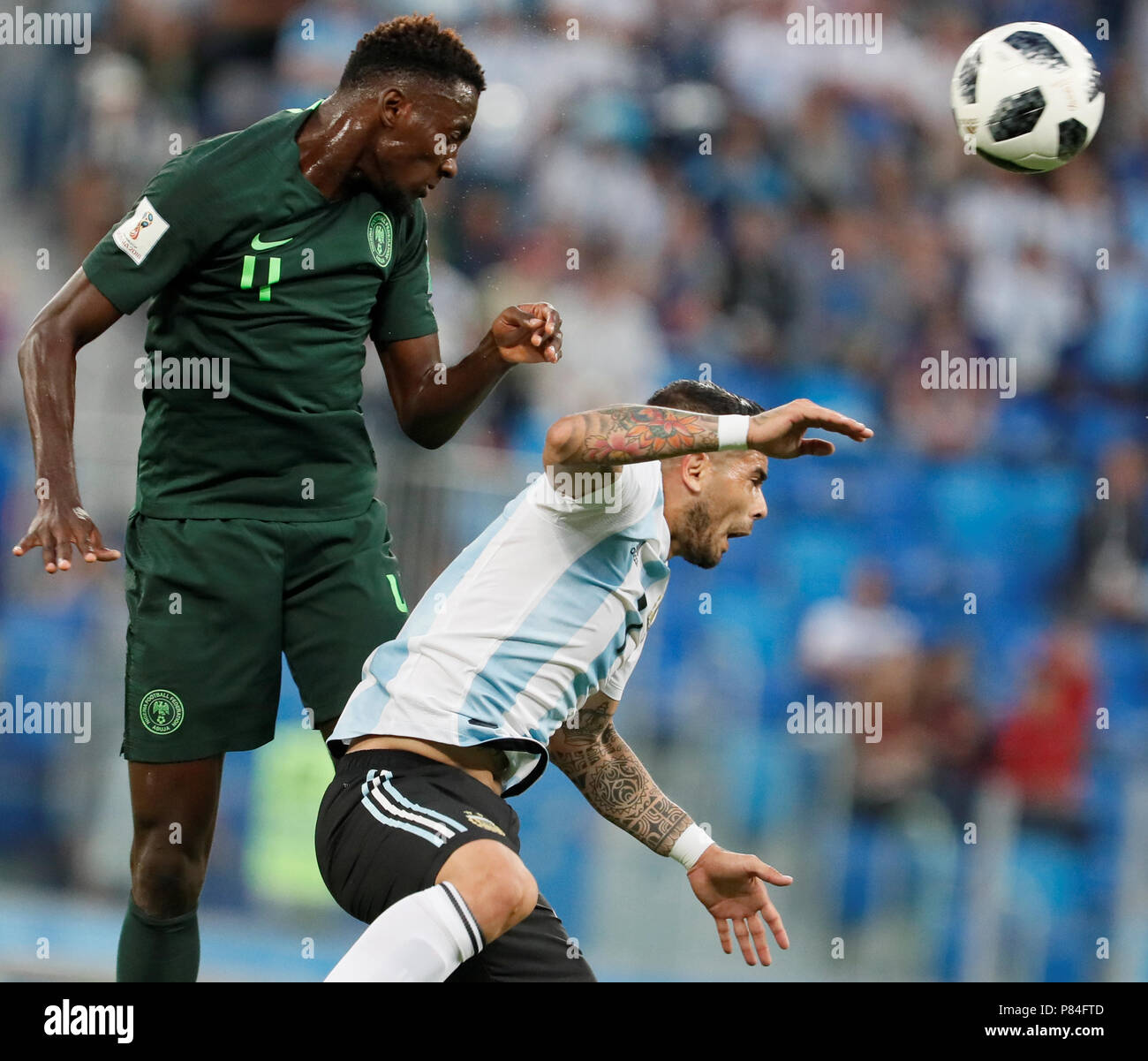 SAINT PETERSBURG, RUSSIA - JUNE 26: Victor Moses (L) of Nigeria national team and Ever Banega of Argentina national team vie for a header during the 2018 FIFA World Cup Russia group D match between Nigeria and Argentina at Saint Petersburg Stadium on June 26, 2018 in Saint Petersburg, Russia. (MB Media) Stock Photo