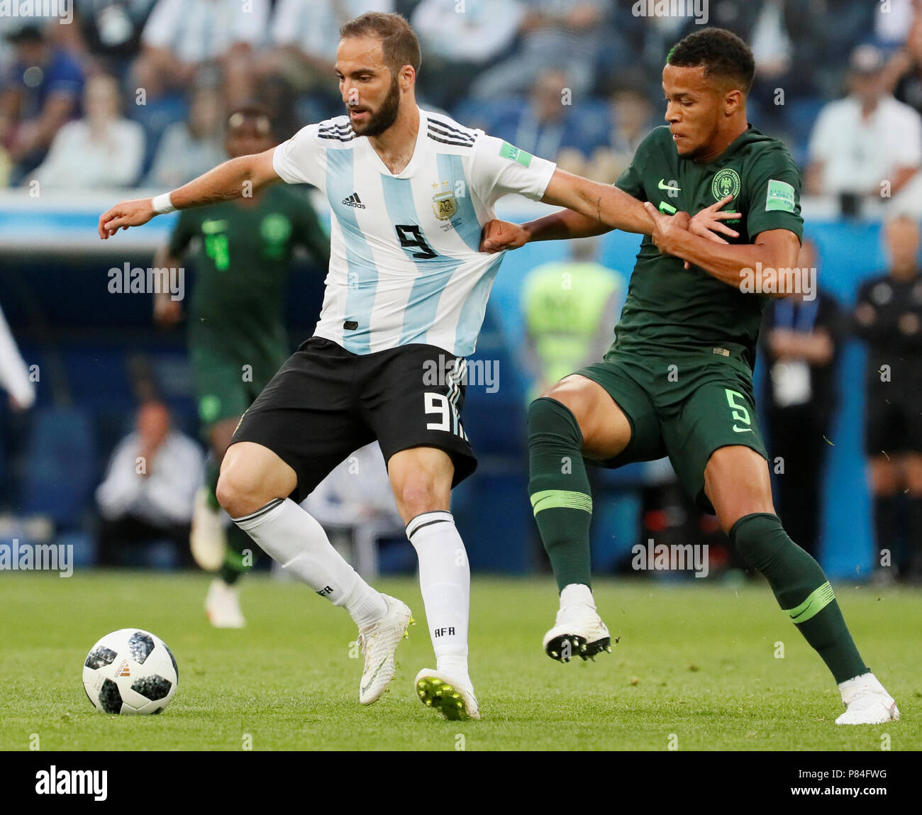 SAINT PETERSBURG, RUSSIA - JUNE 26: William Ekong (R) of Nigeria national team and Gonzalo Higuain of Argentina national team vie for the ball during the 2018 FIFA World Cup Russia group D match between Nigeria and Argentina at Saint Petersburg Stadium on June 26, 2018 in Saint Petersburg, Russia. (MB Media) Stock Photo