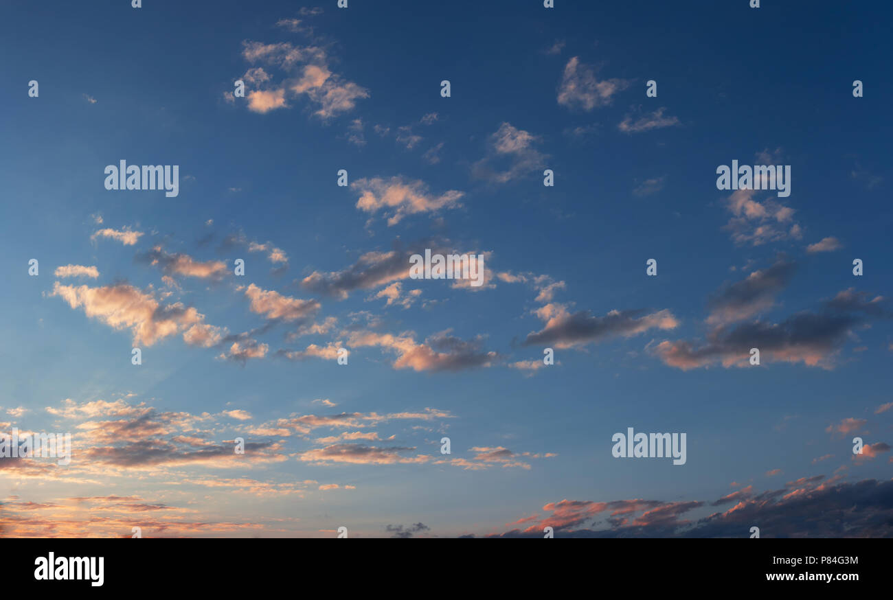 Sunset sky with some sparse clouds Stock Photo