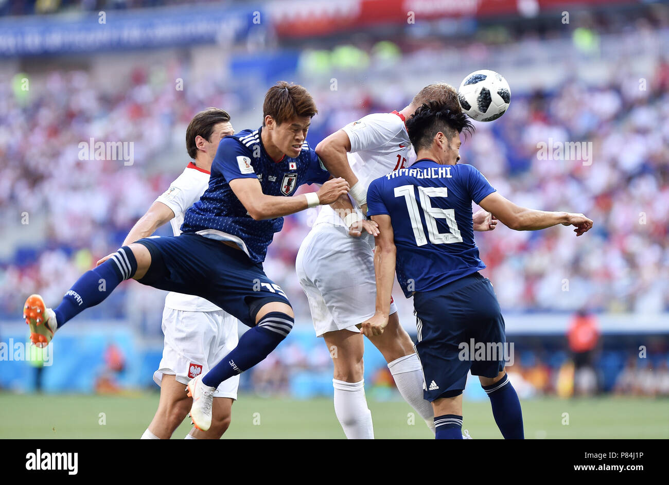 VOLGOGRAD, RUSSIA - JUNE 28: Yuya Osako and Hotaru Yamaguchi of Japan competes with Kamil Glik of Poland during the 2018 FIFA World Cup Russia group H match between Japan and Poland at Volgograd Arena on June 28, 2018 in Volgograd, Russia. (Photo by Lukasz Laskowski/PressFocus/MB Media/) Stock Photo