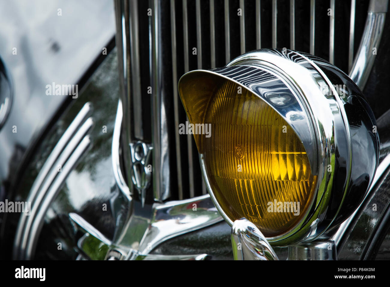 Fog Headlight on the front of a vintage Plymouth Chrysler car Stock