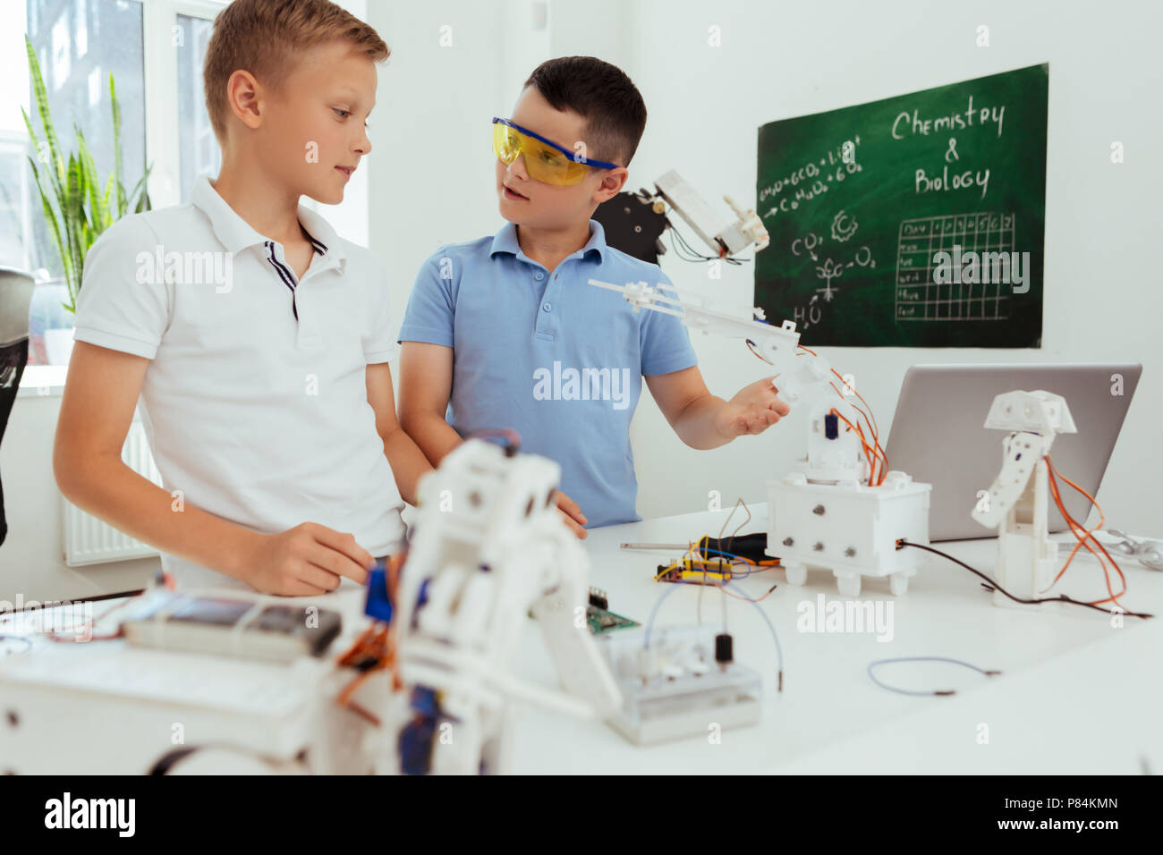 Smart nice boys talking to each other Stock Photo