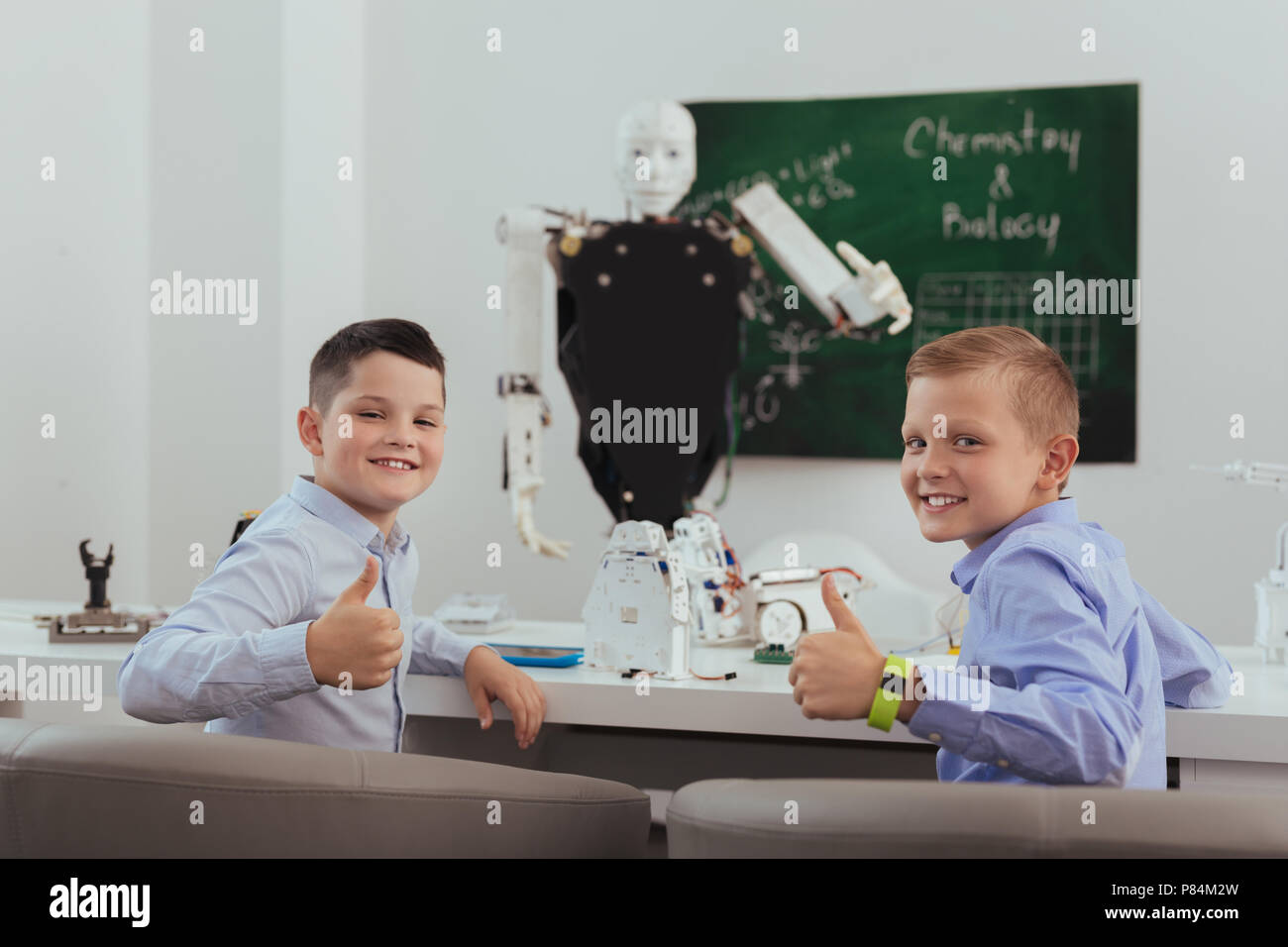 Happy positive boys showing Ok signs Stock Photo