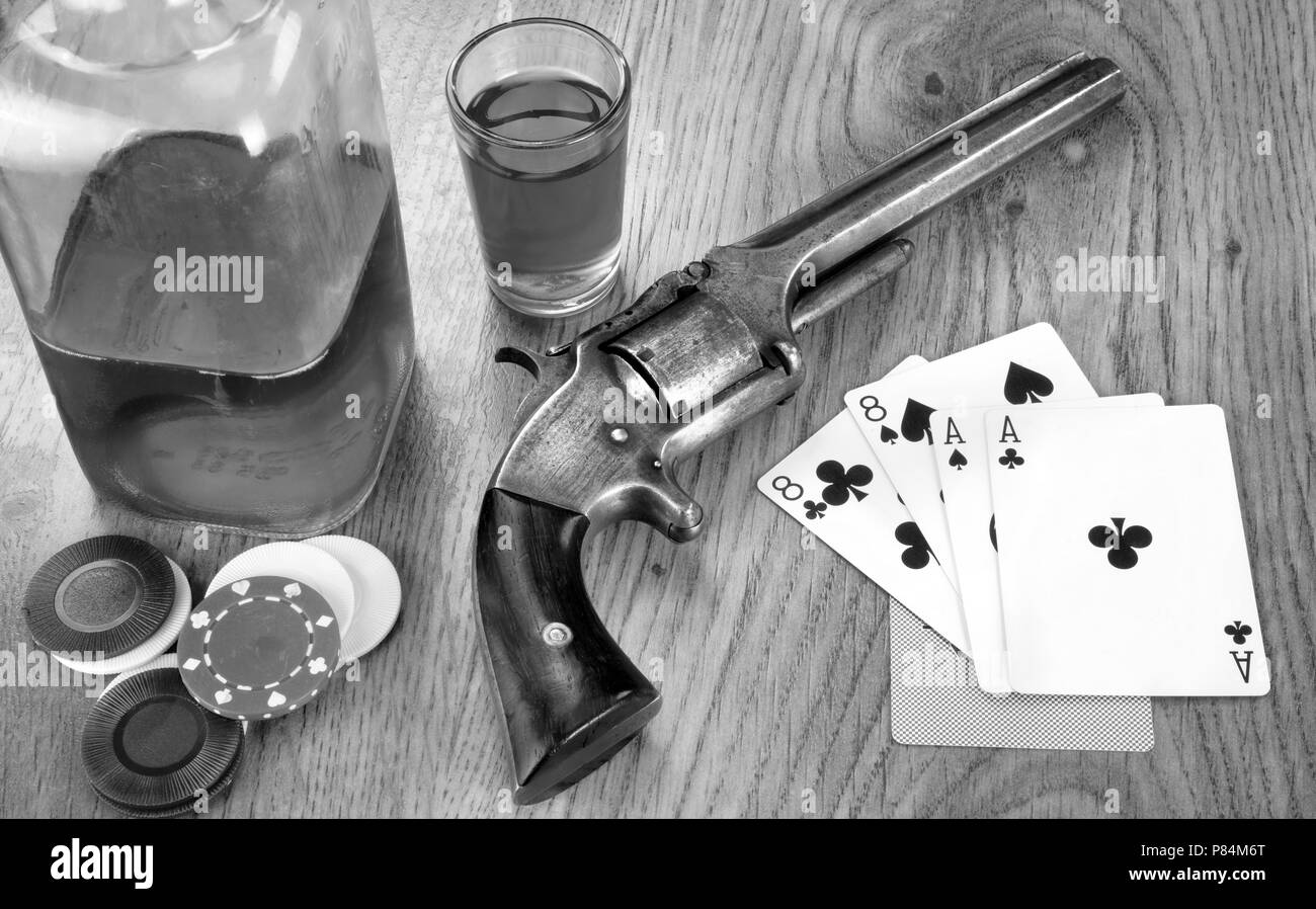 Dead mans hand aces and eights with Wild Bill's six shooter in black and white. Stock Photo