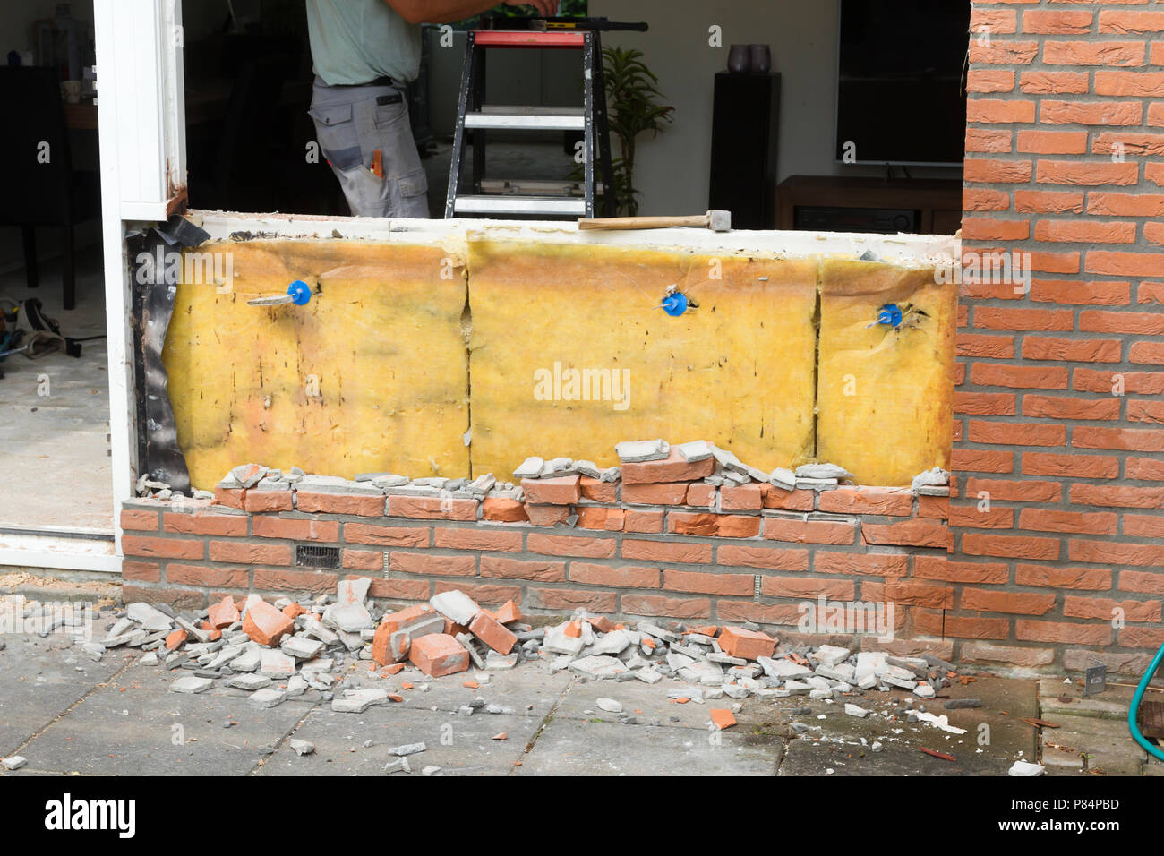Breaking up a brick wall Remodeling a house Stock Photo Alamy