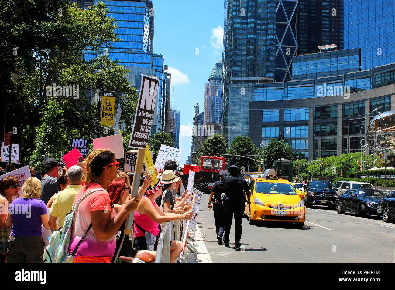 NEW YORK, NY - JULY 02: Activists rally at a Rise and Resist organized Trump Impeachment protest in front of the Trump International Hotel & Tower. Stock Photo