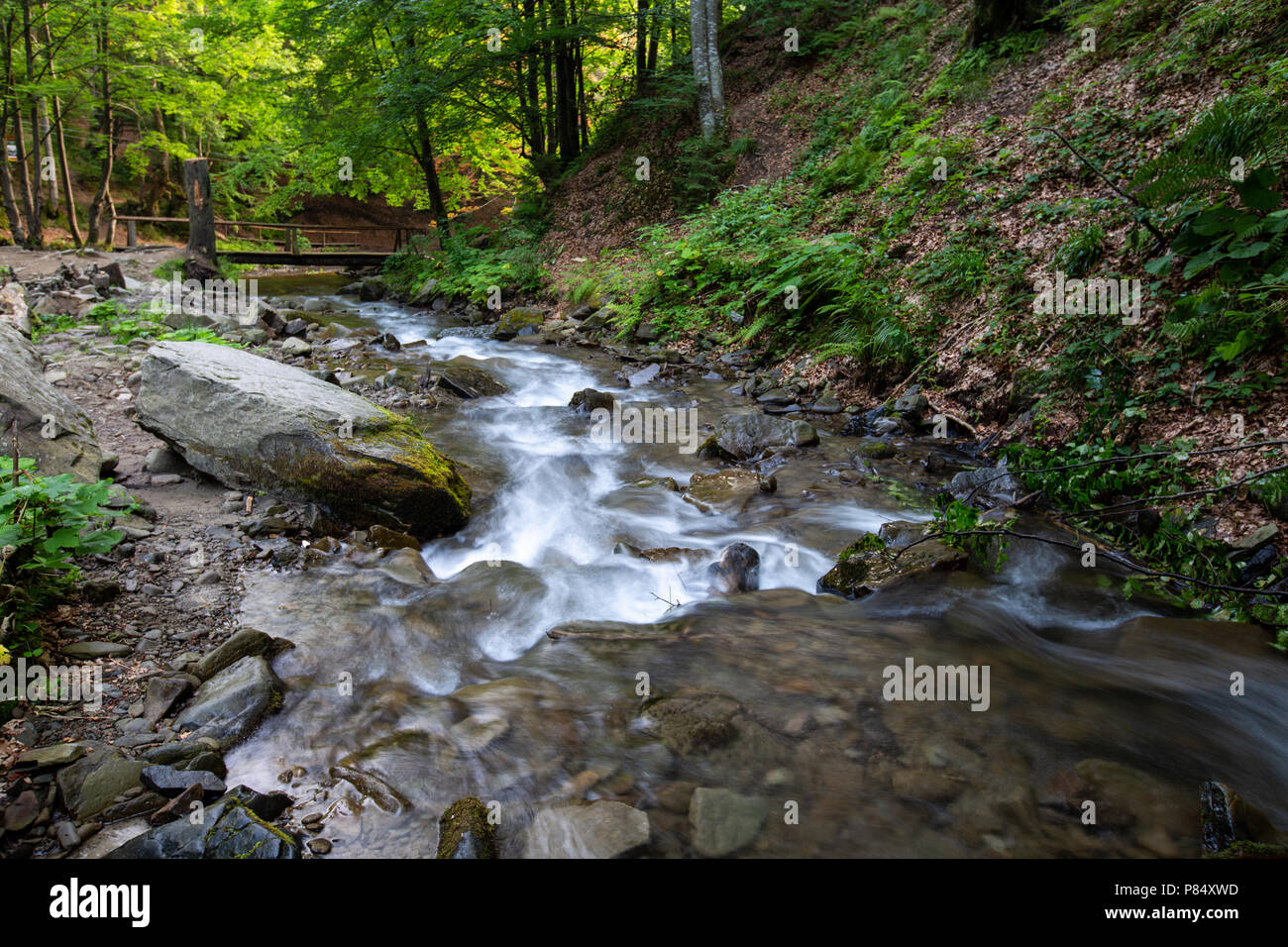 Free flowing stream cascades hi-res stock photography and images - Alamy