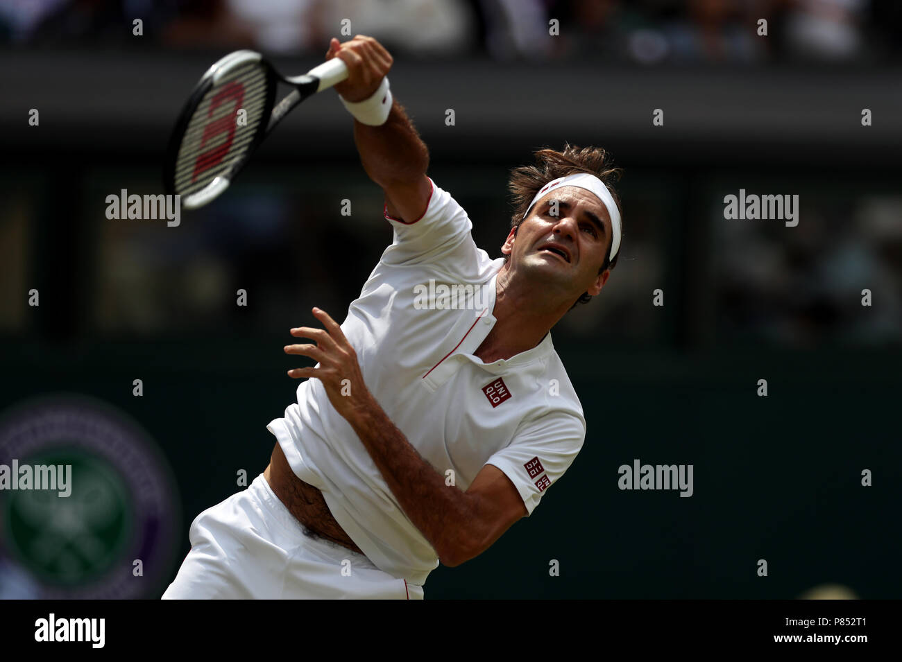 Roger Federer in action on day seven of the Wimbledon Championships at the All England Lawn Tennis and Croquet Club, Wimbledon. PRESS ASSOCIATION Photo. Picture date: Monday July 9, 2018. See PA story TENNIS Wimbledon. Photo credit should read: Jonathan Brady/PA Wire. Stock Photo