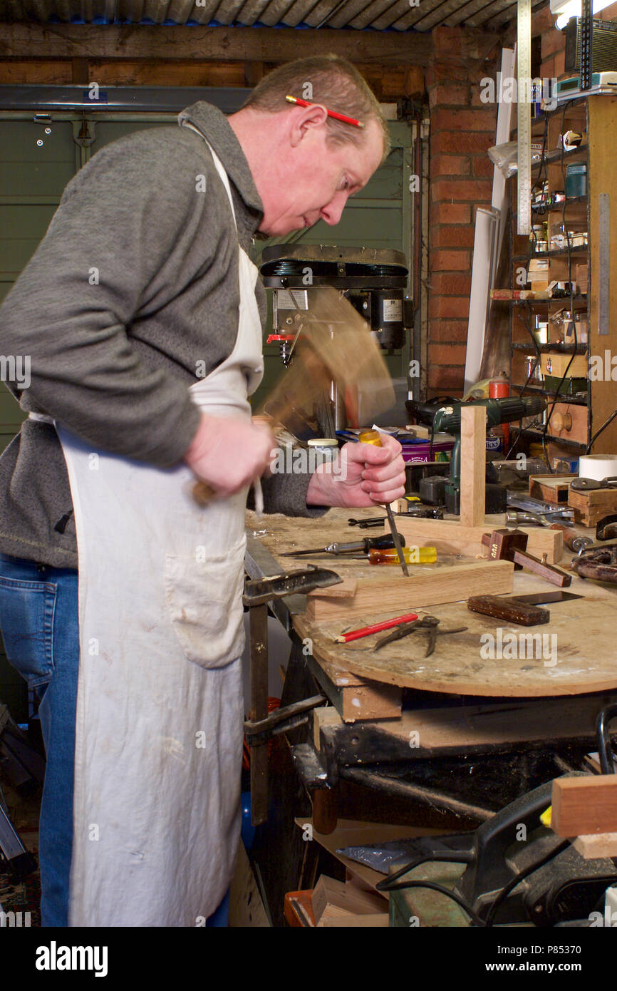 Cabinet Maker At Work In His Garage Workshop Stock Photo