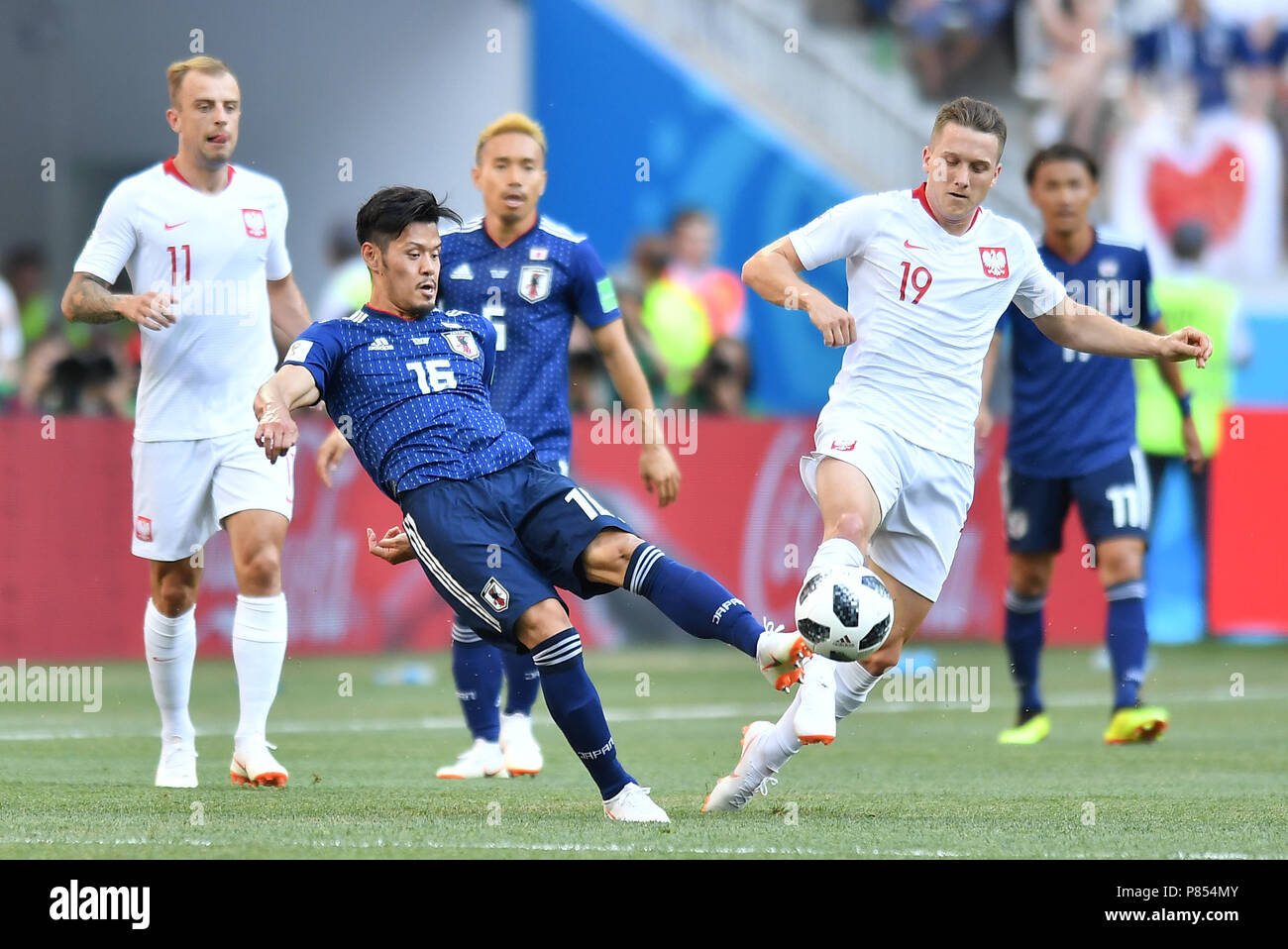 VOLGOGRAD, RUSSIA - JUNE 28: Hotaru Yamaguchi of Japan competes with Piotr Zielinski of Poland during the 2018 FIFA World Cup Russia group H match between Japan and Poland at Volgograd Arena on June 28, 2018 in Volgograd, Russia. (Photo by Lukasz Laskowski/PressFocus/MB Media/) Stock Photo