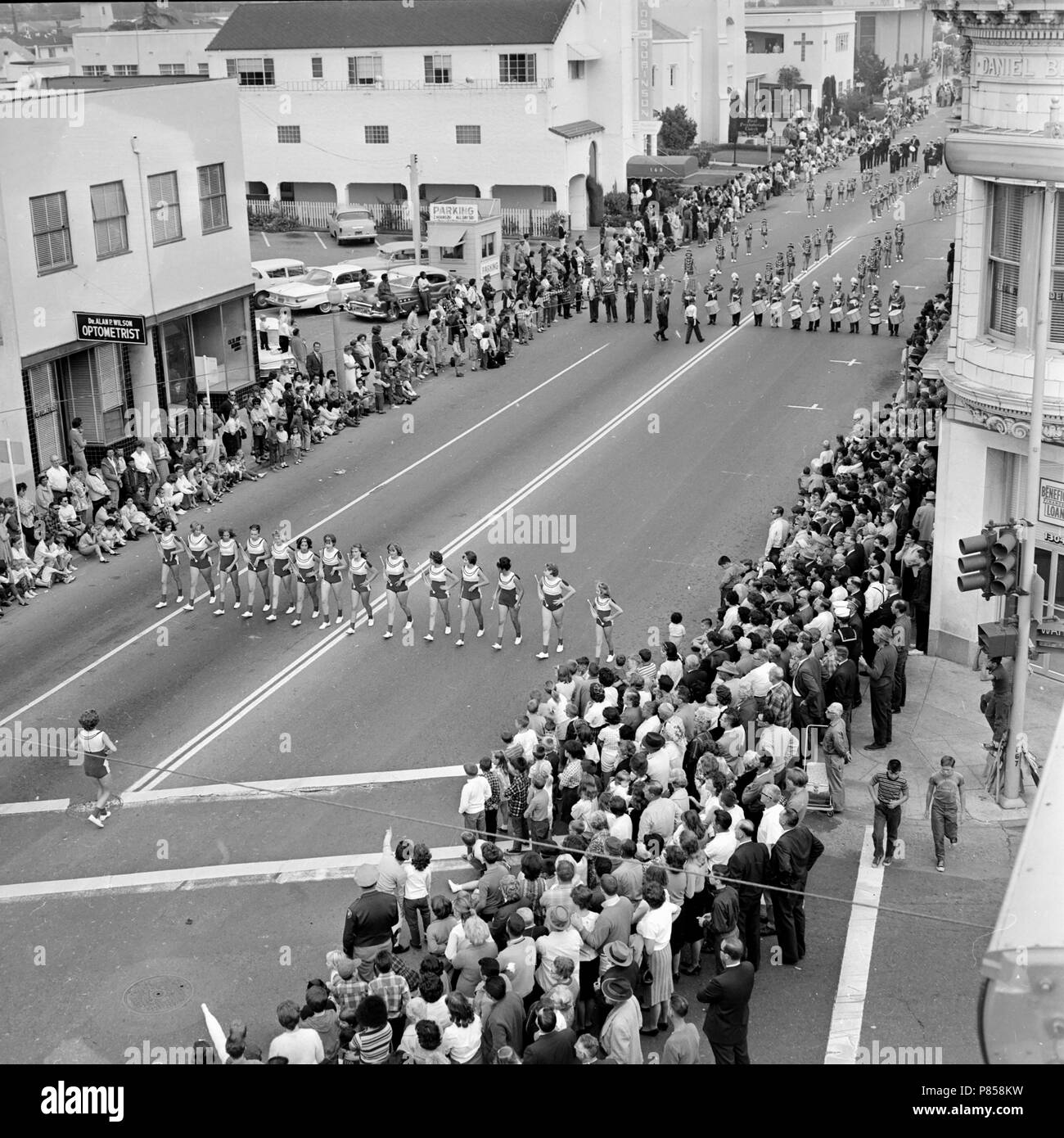 The citizens of San Leandro, California crowd the main street to watch a community parade, ca. 1964. Stock Photo