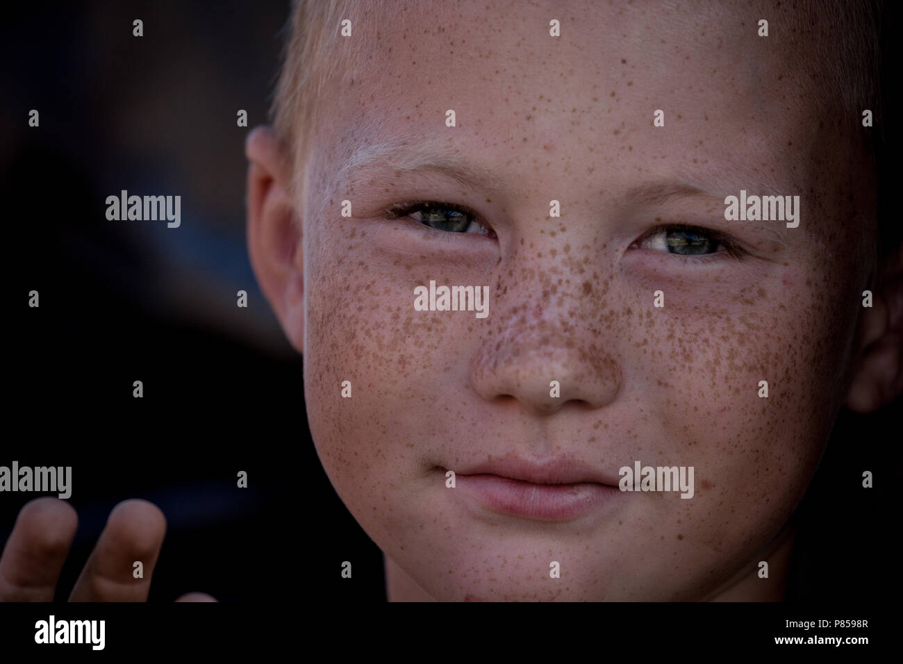 a portrait of a freckle face boy in Kazakistan. Stock Photo
