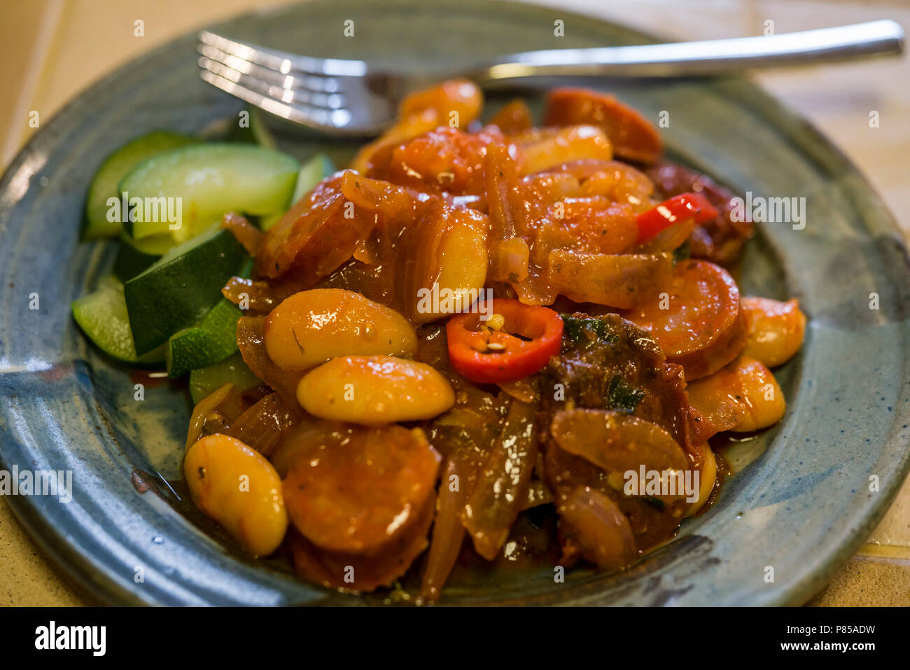 Food shot a cassoulet made with lamb, chorizo, sausage, onions, beans