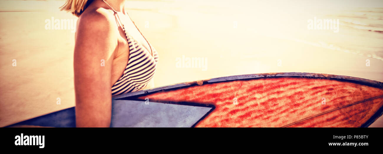 Woman beach holding sea hi-res stock photography and images - Alamy