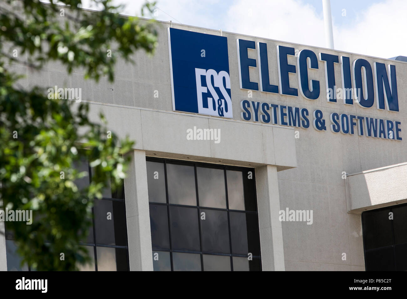 A logo sign outside of the headquarters of Election Systems & Software ...